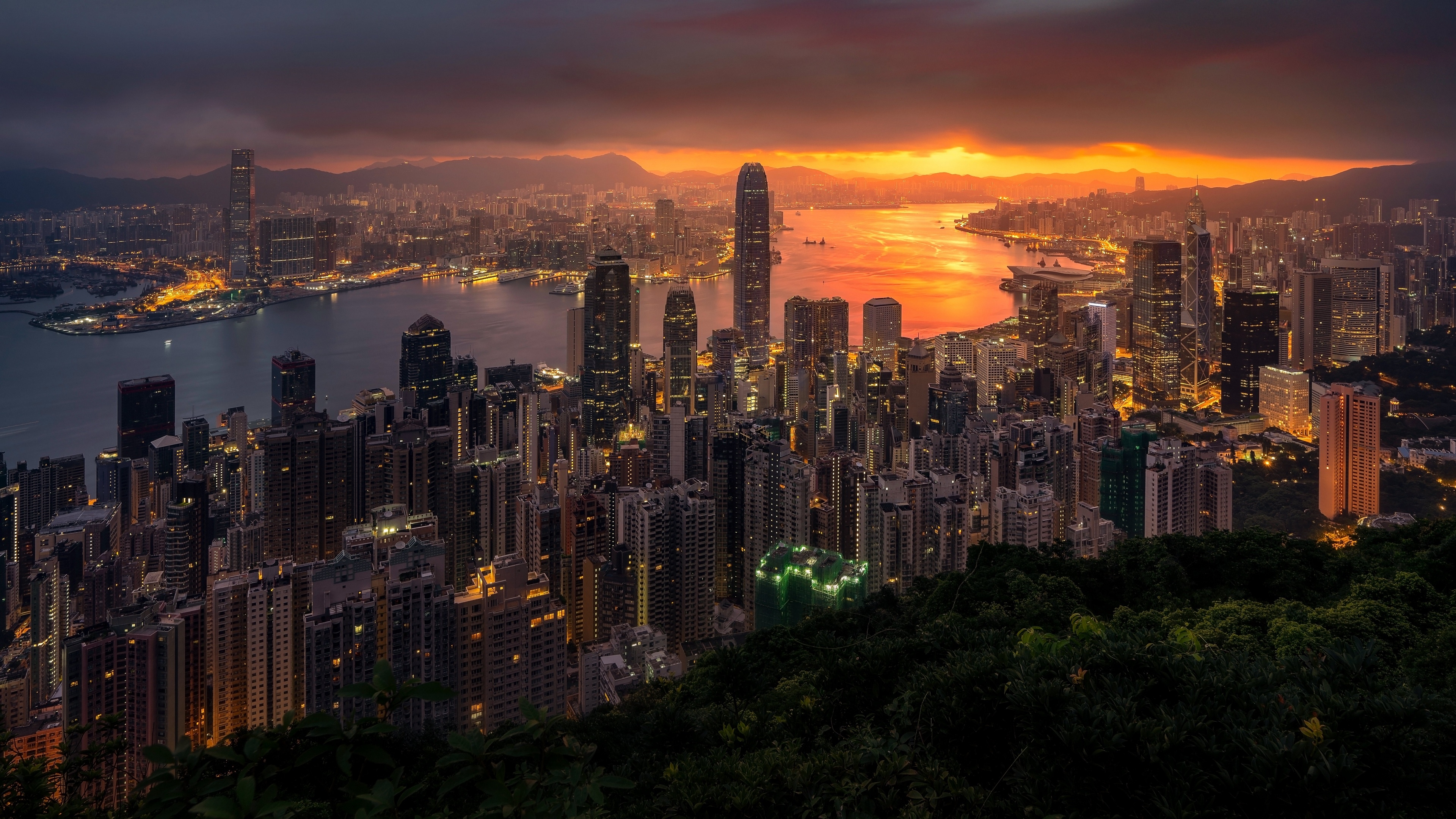 4K Hong Kong cityscape at sunset with clouds HD Wallpaper