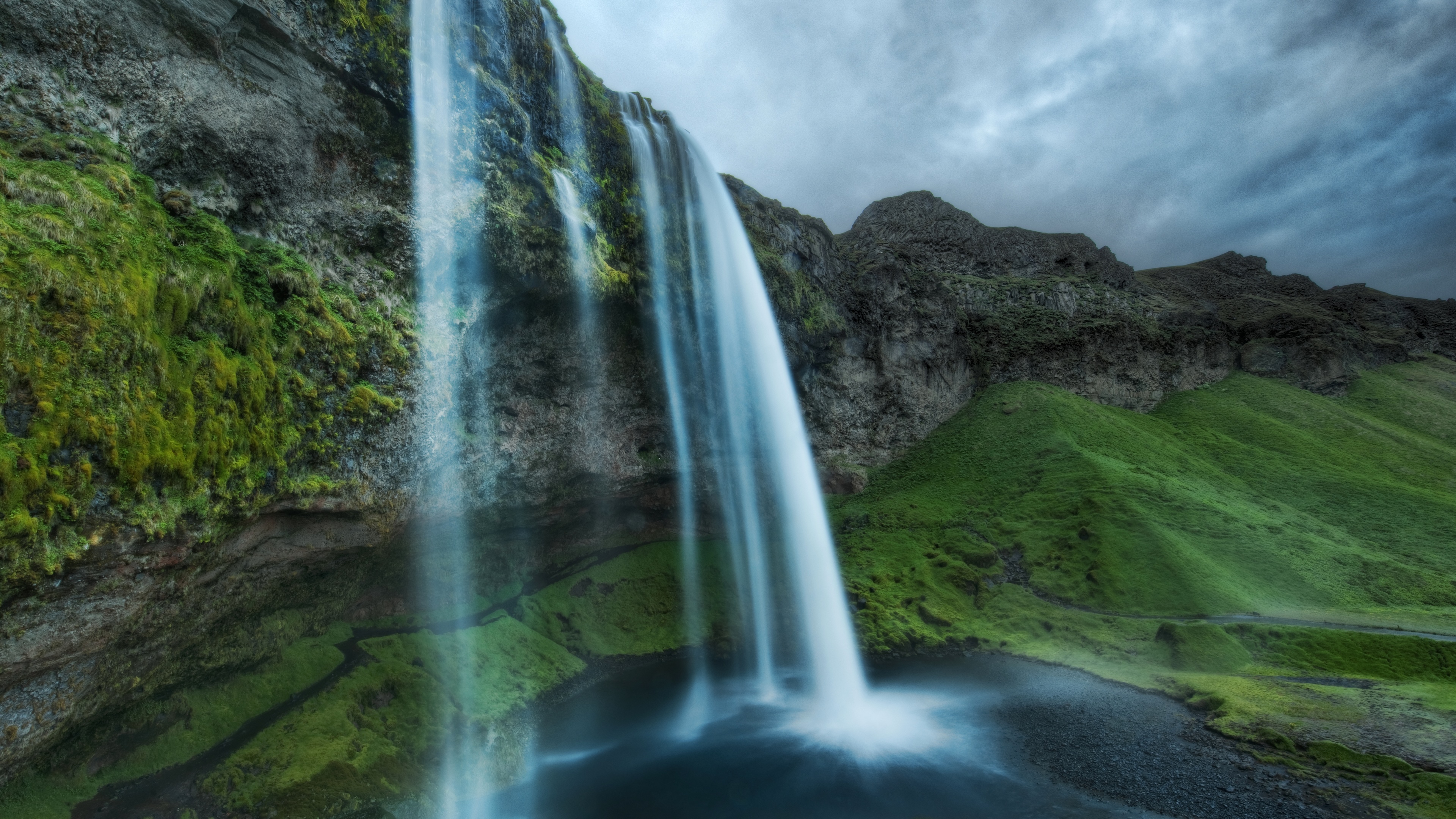 4K Iceland Waterfall with Dramatic Clouds HD Wallpaper