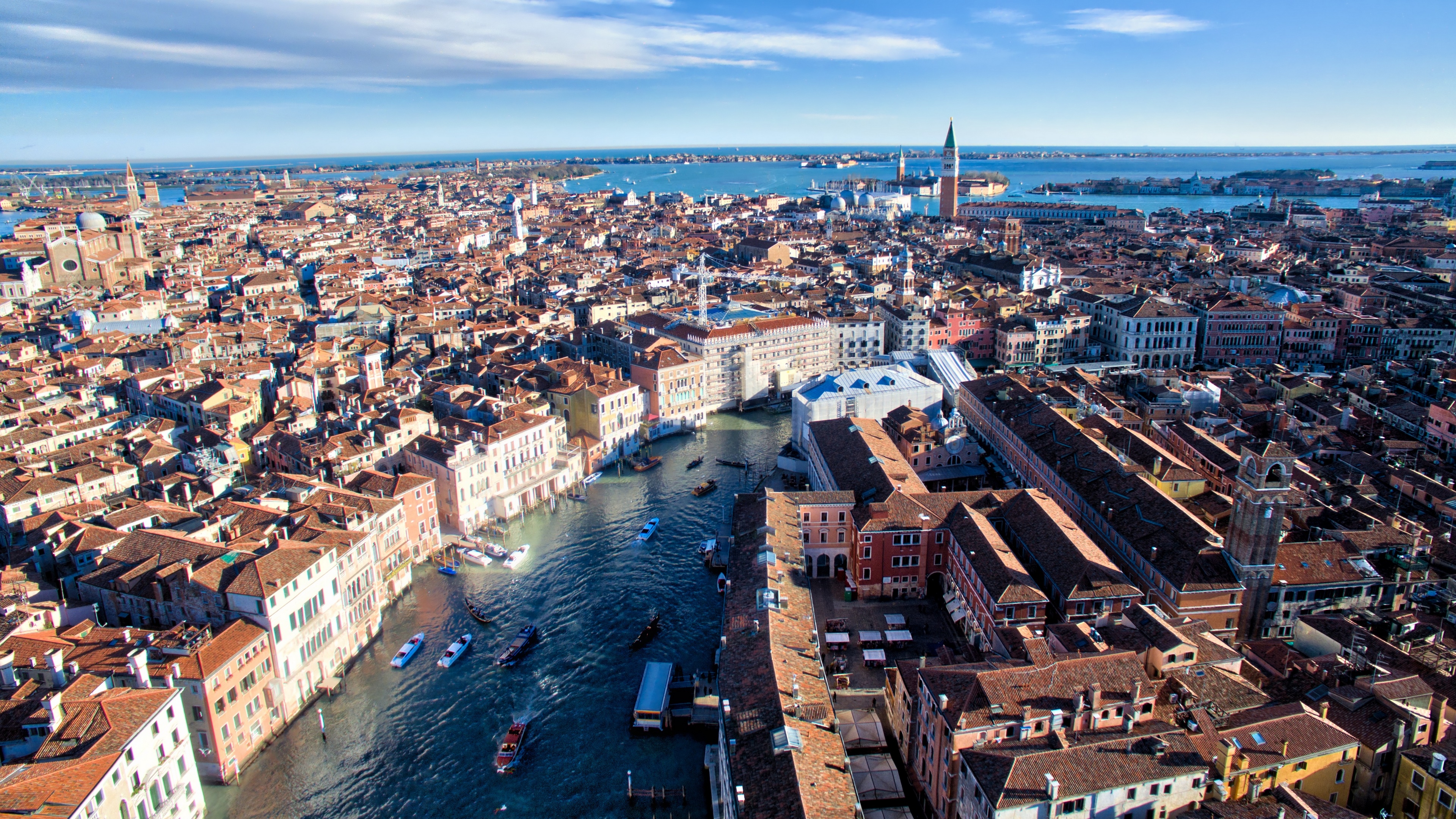 4K Aerial View of Venice Canal with Boats and Buildings HD Wallpaper