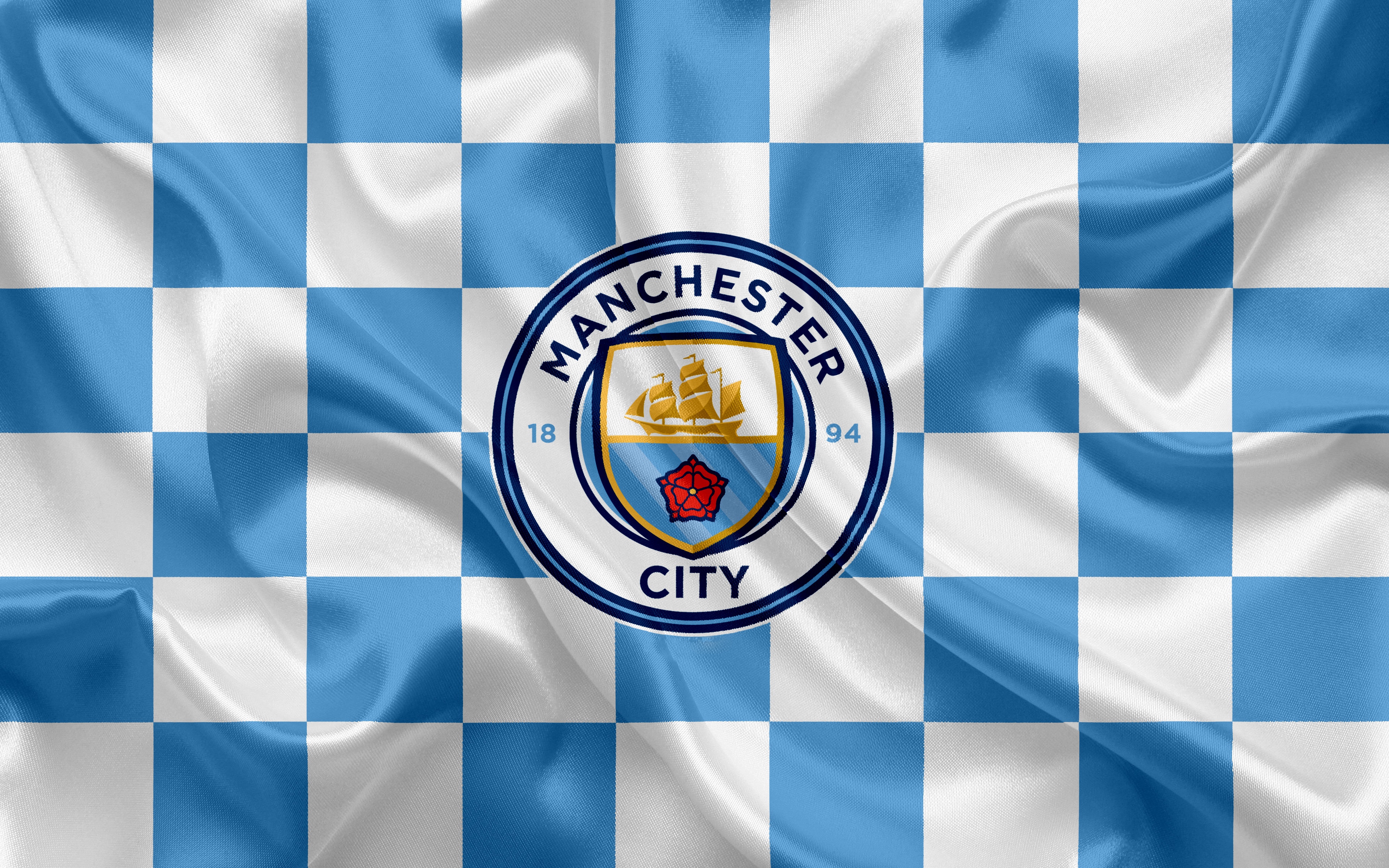 Manchester City logo on checkered flag HD Wallpaper