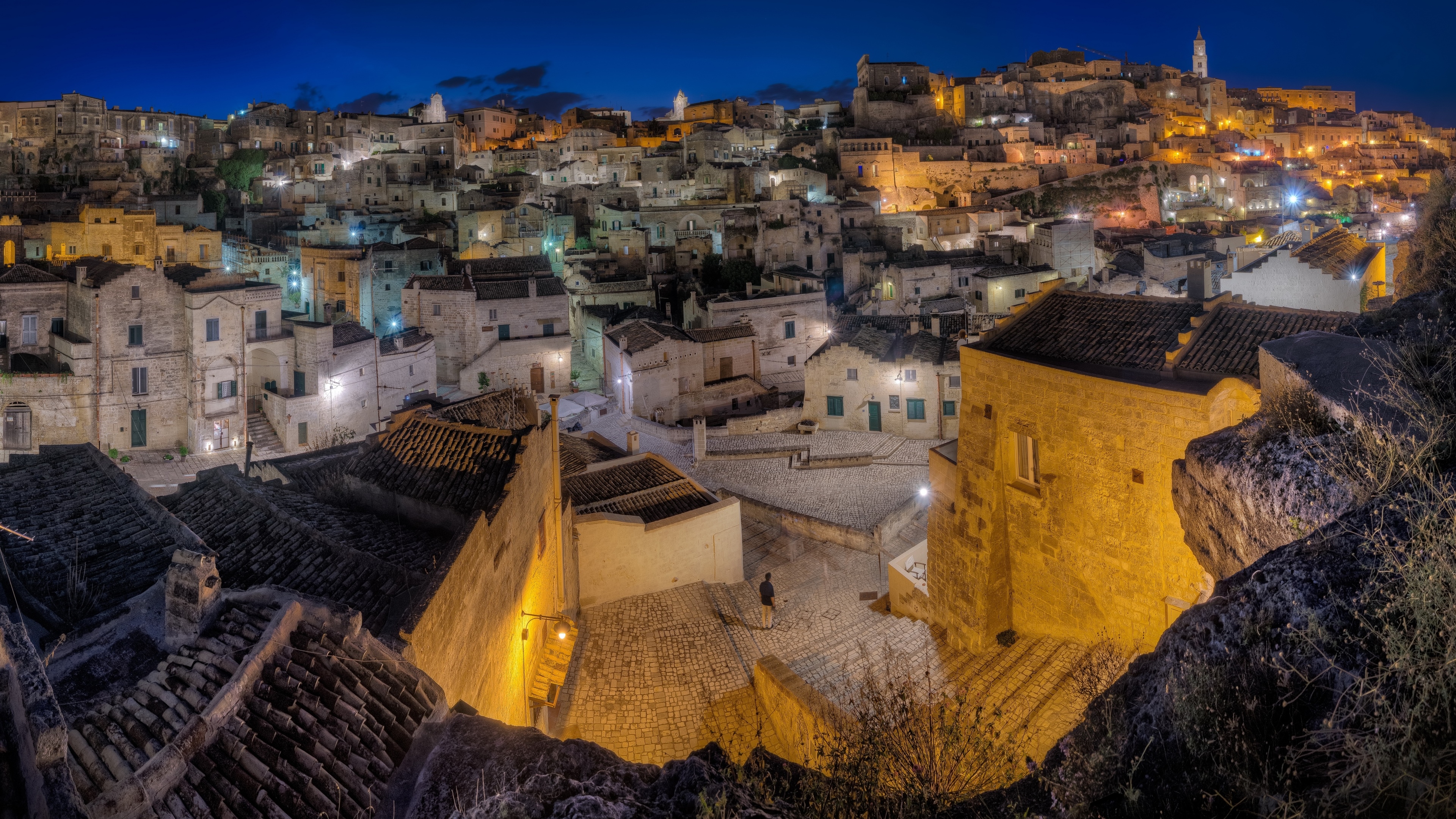 4K night view of Matera, Italy with illuminated buildings HD Wallpaper
