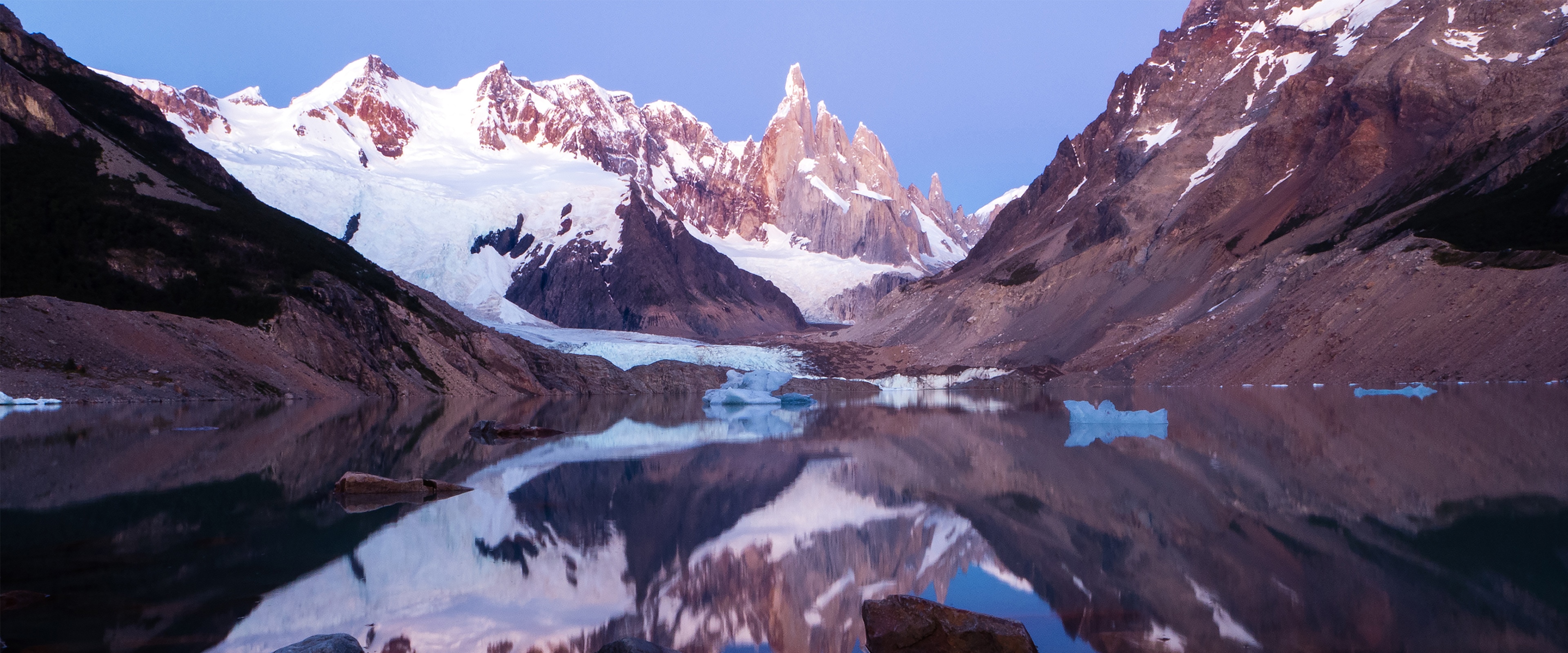 4K snow-capped mountains reflected in a lake HD Wallpaper