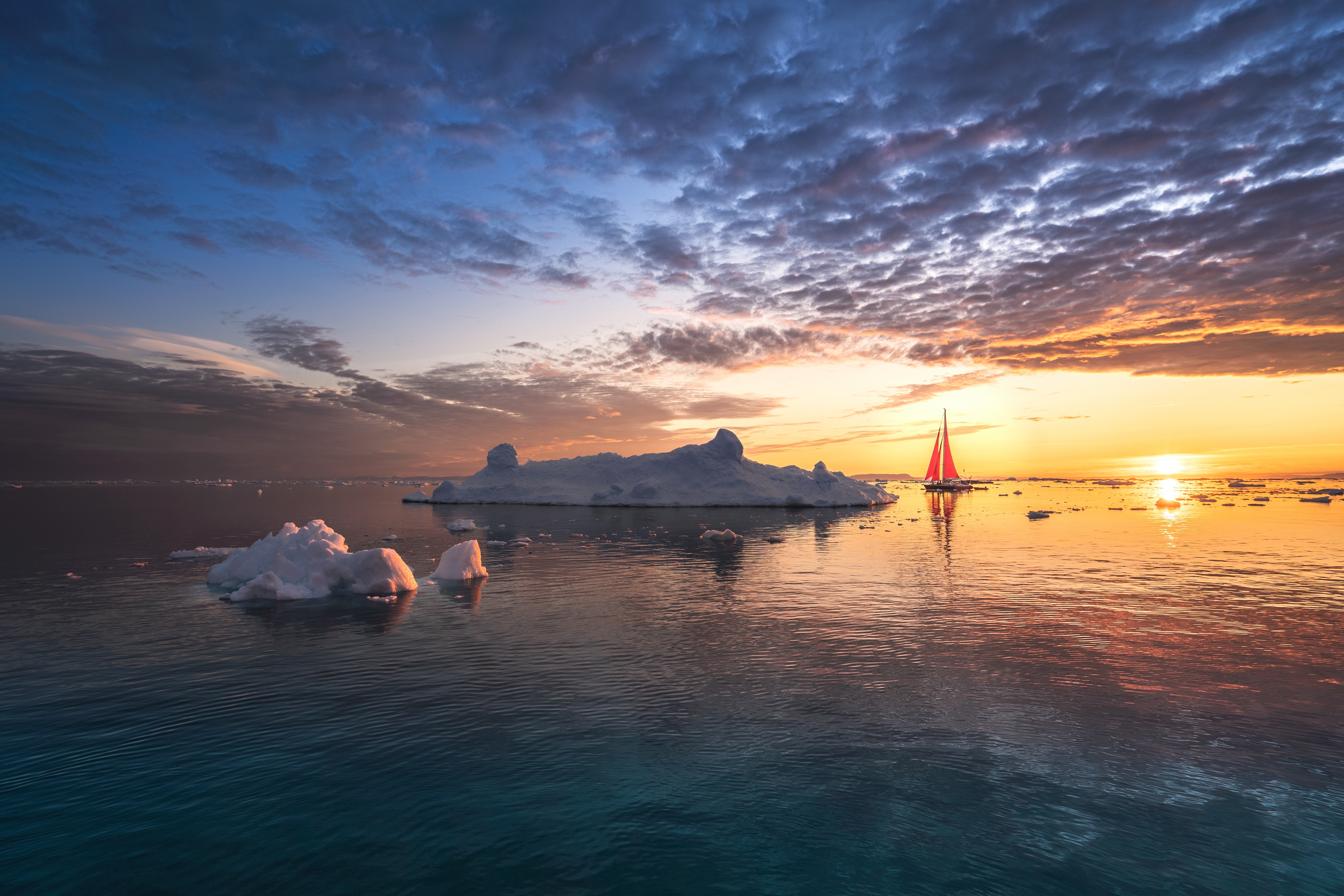 Sailboat near icebergs at sunset HD Wallpaper