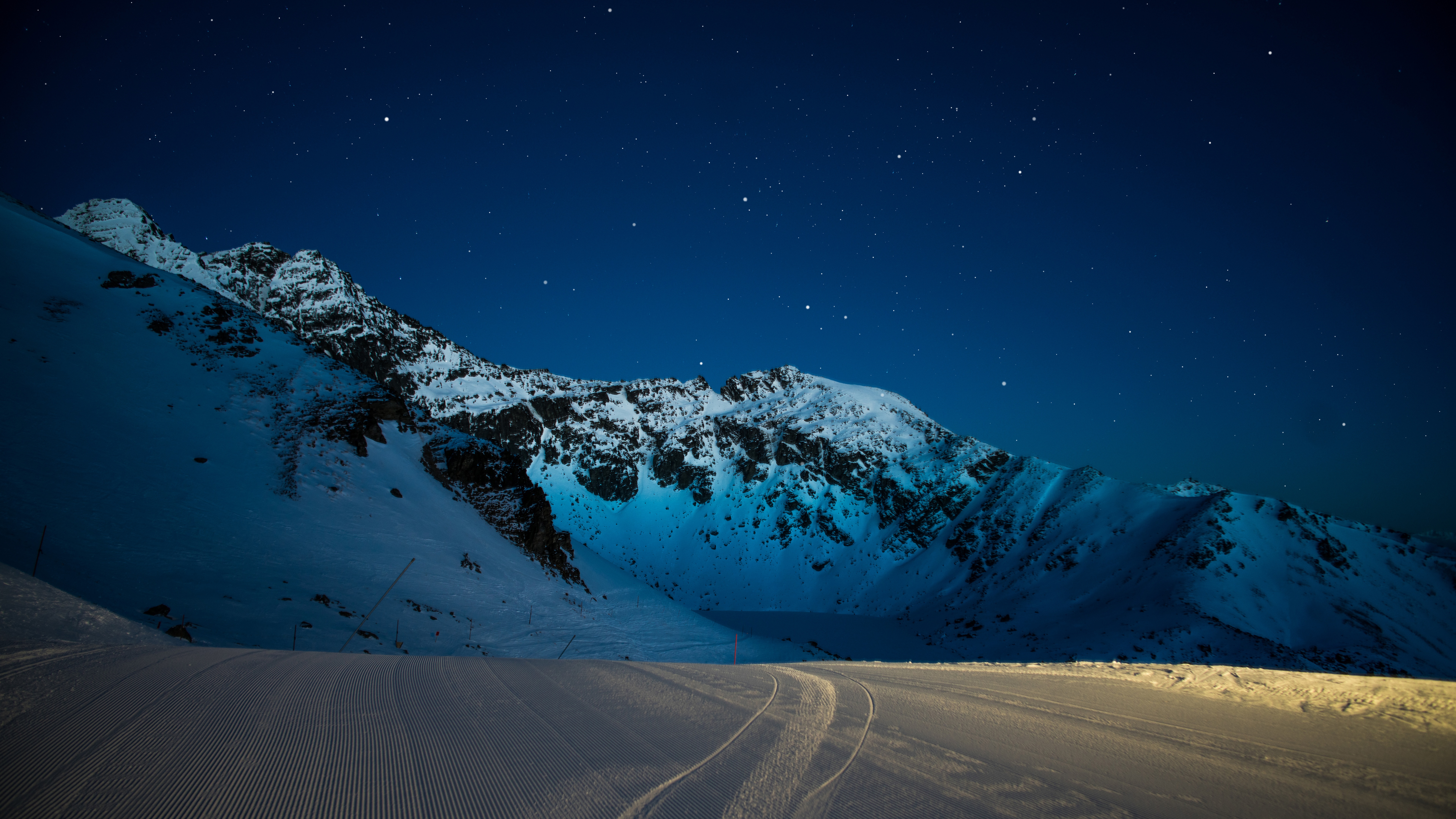 4K Snowy Mountains Under a Starry Night Sky HD Wallpaper