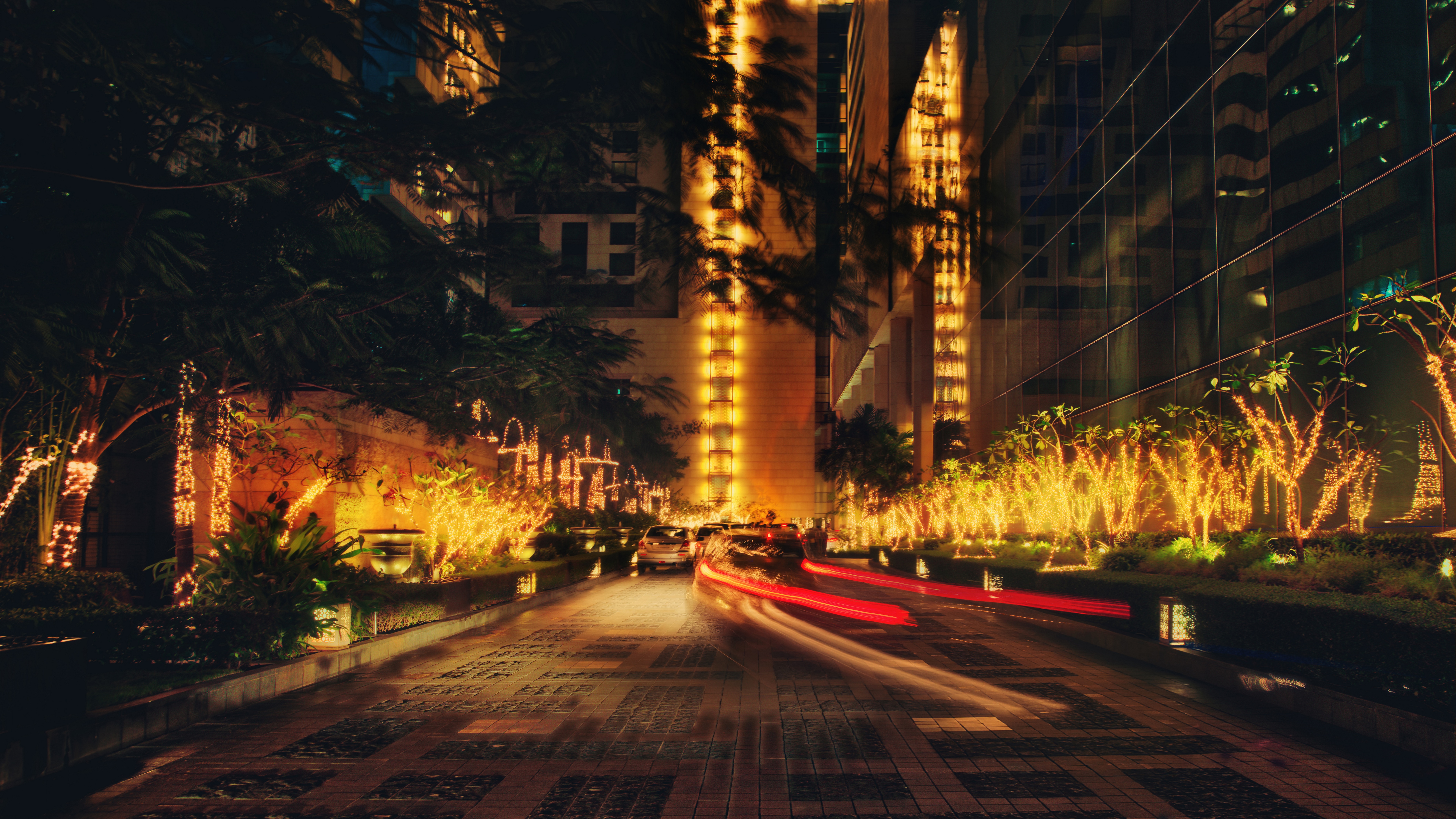 Night cityscape with cars and building lights HD Wallpaper