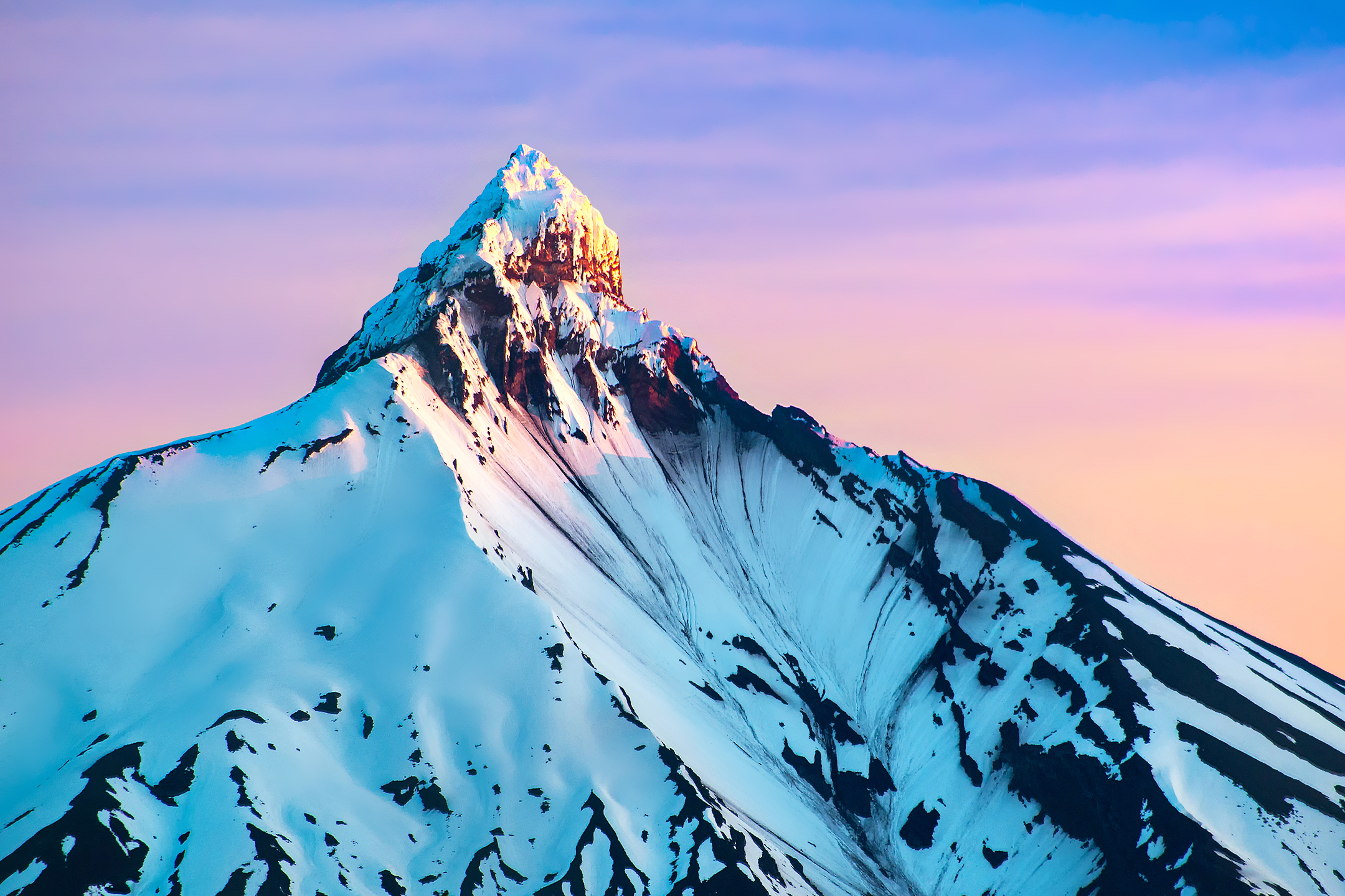 Snow-covered mountain peak at sunrise HD Wallpaper