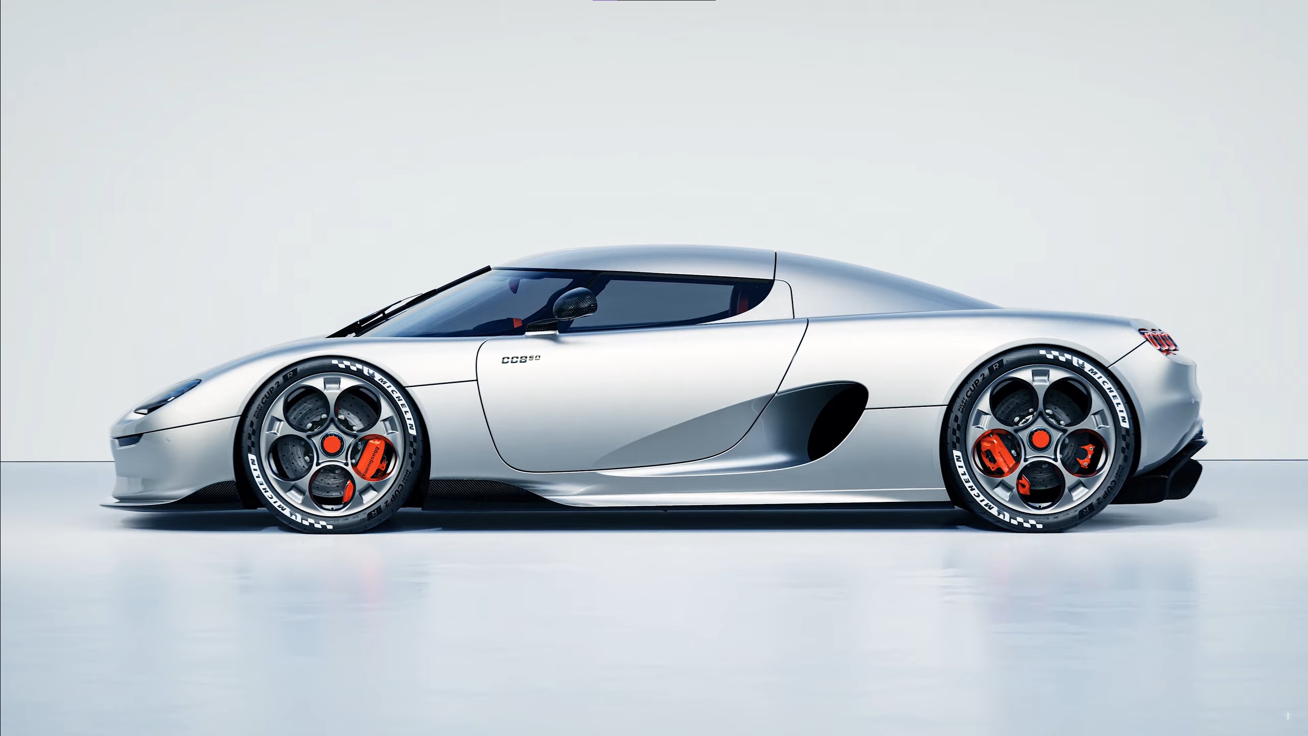 Silver Koenigsegg CC850 hypercar on a white background HD Wallpaper