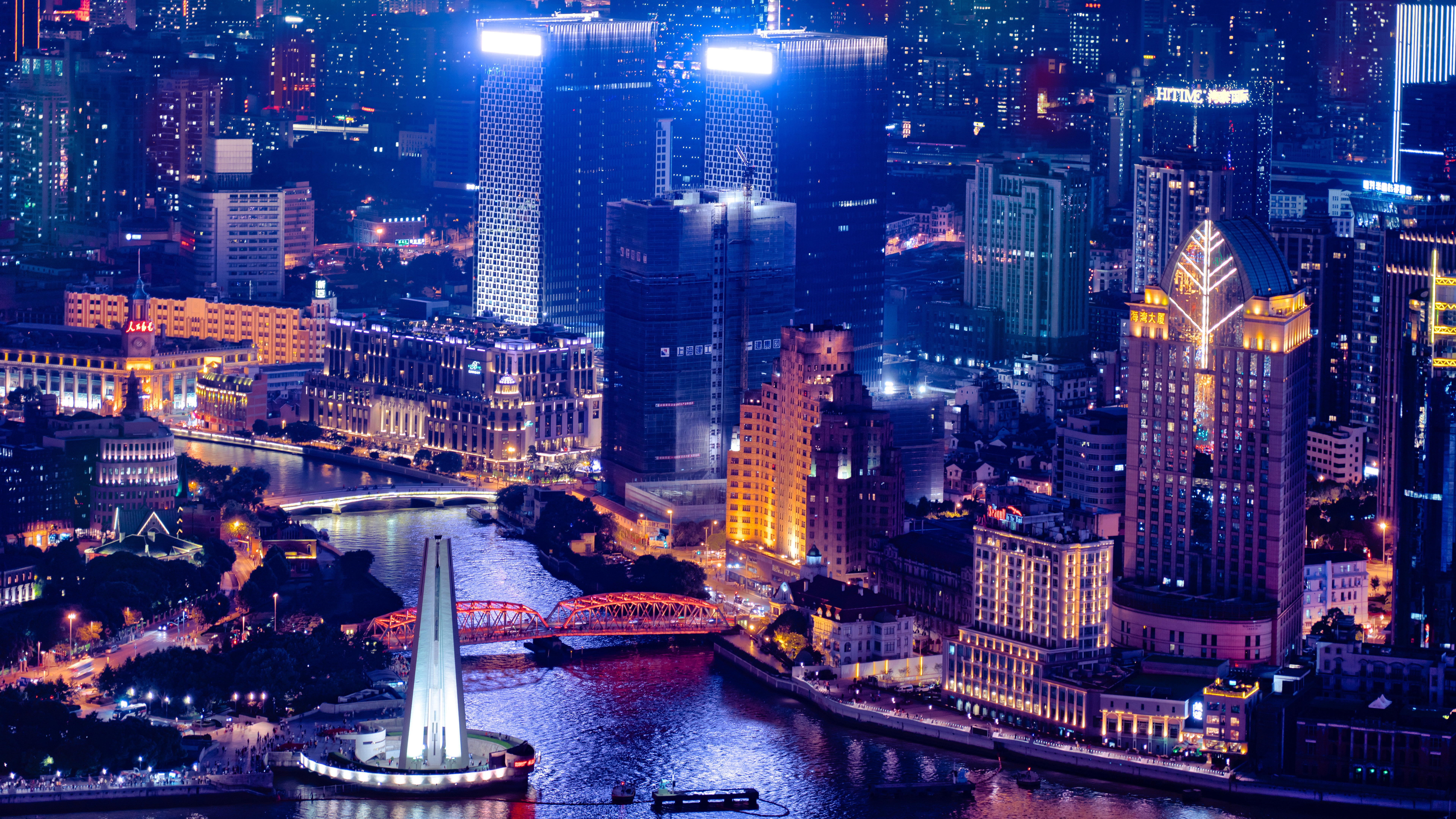 4K Shanghai cityscape at night with skyscrapers and river HD Wallpaper
