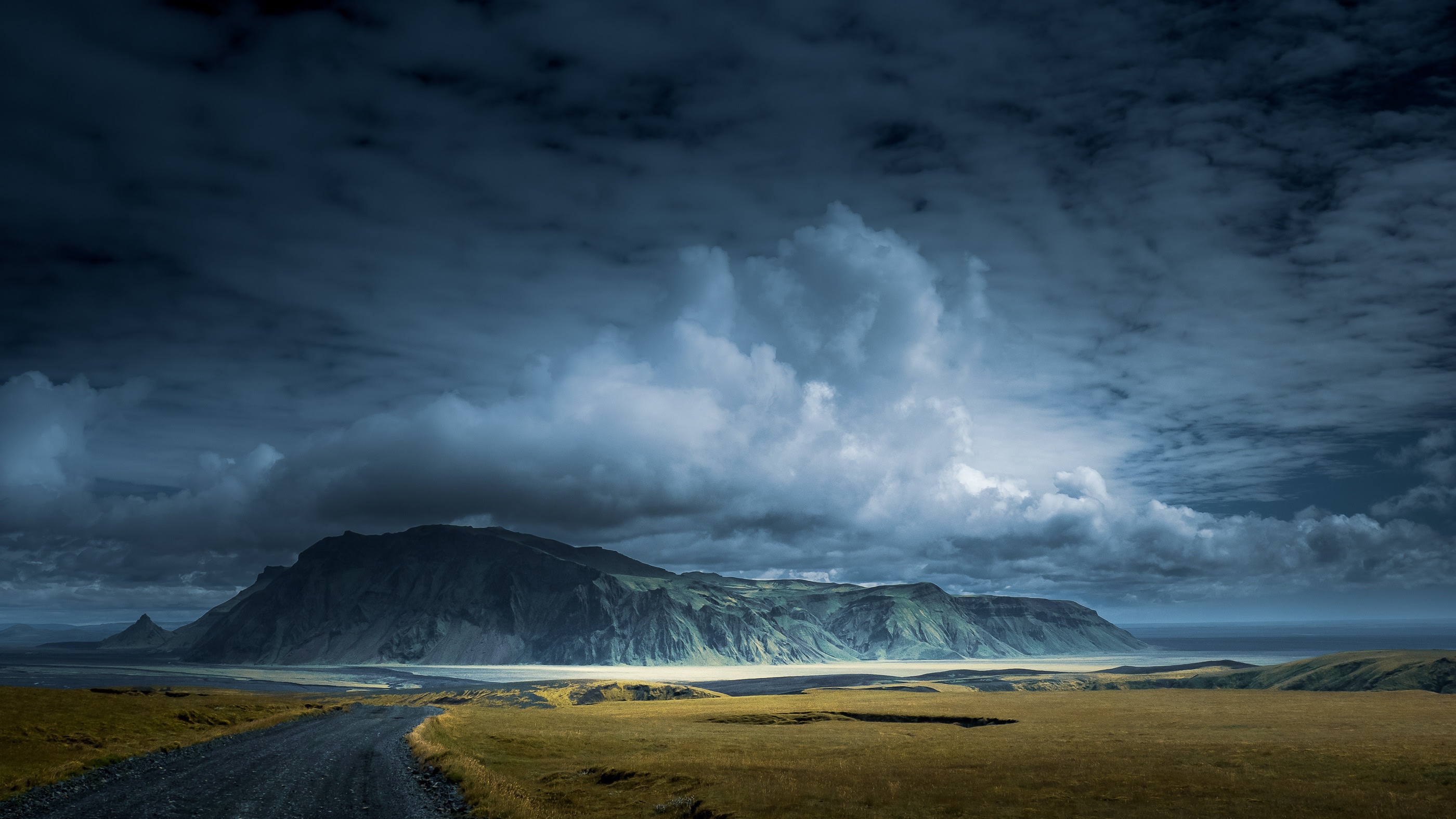 Icelandic landscape with mountains and a road HD Wallpaper