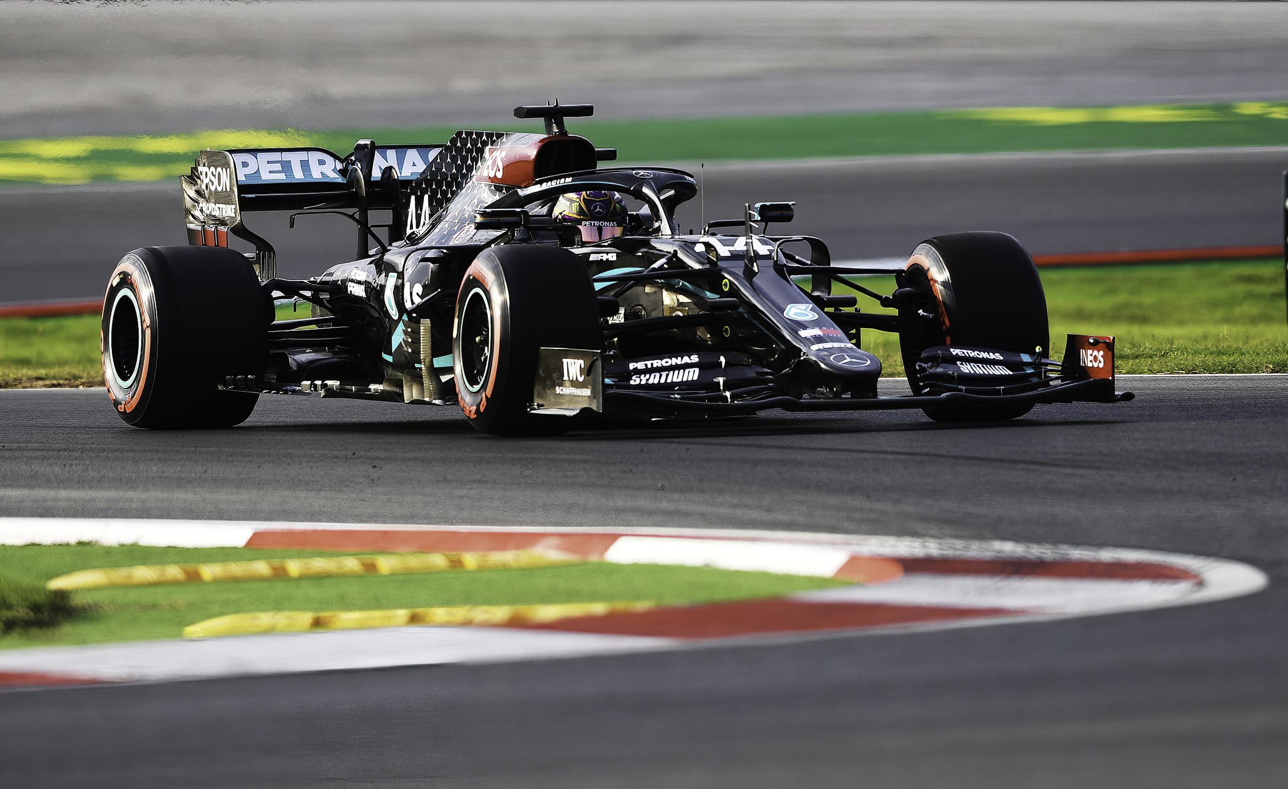 Lewis Hamilton driving a Mercedes Formula 1 car HD Wallpaper
