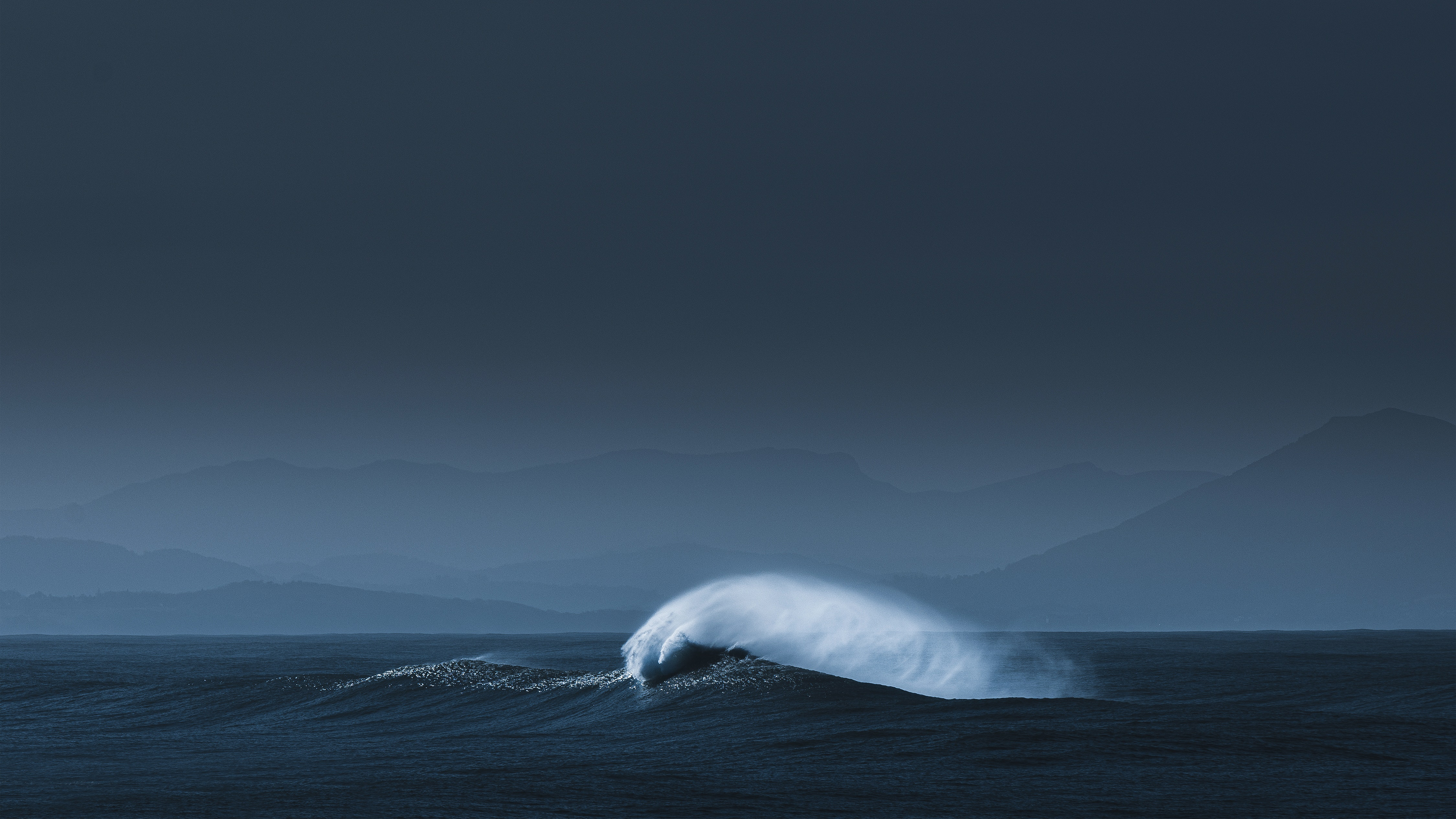 Waves crashing near mountains in France HD Wallpaper