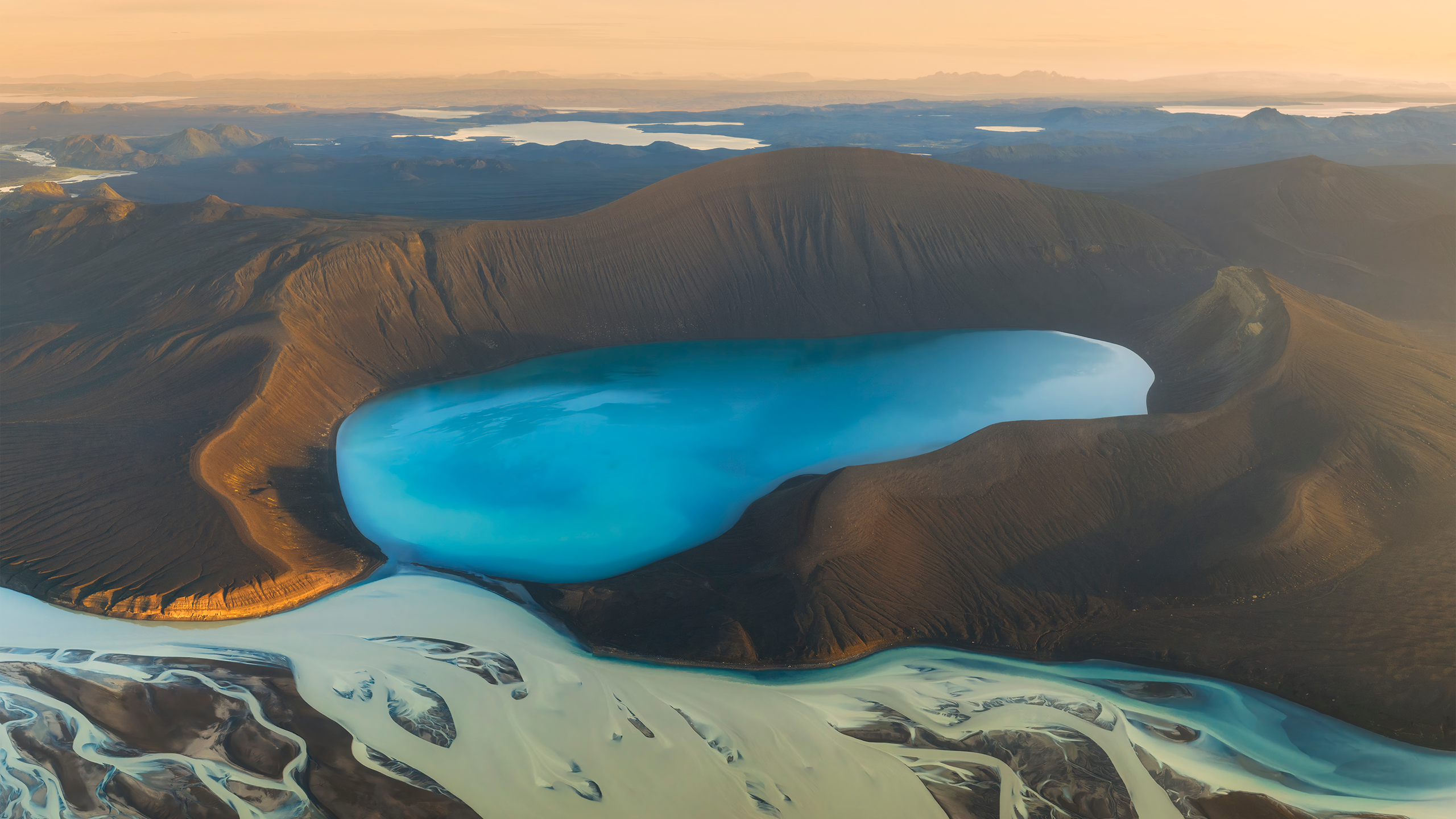 Aerial view of a blue lake in Iceland with river delta HD Wallpaper