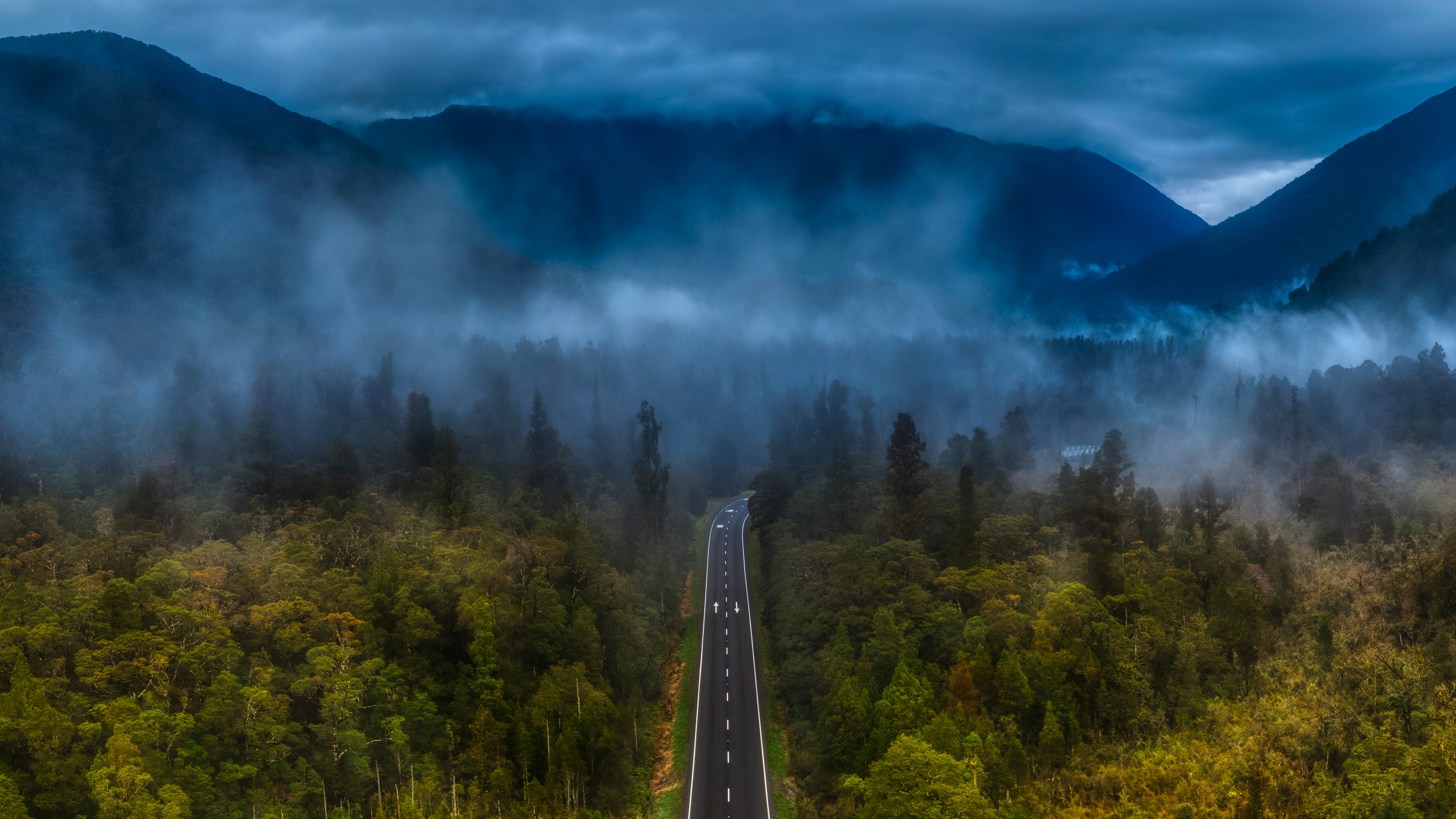 4K road through misty mountains and forest in New Zealand HD Wallpaper