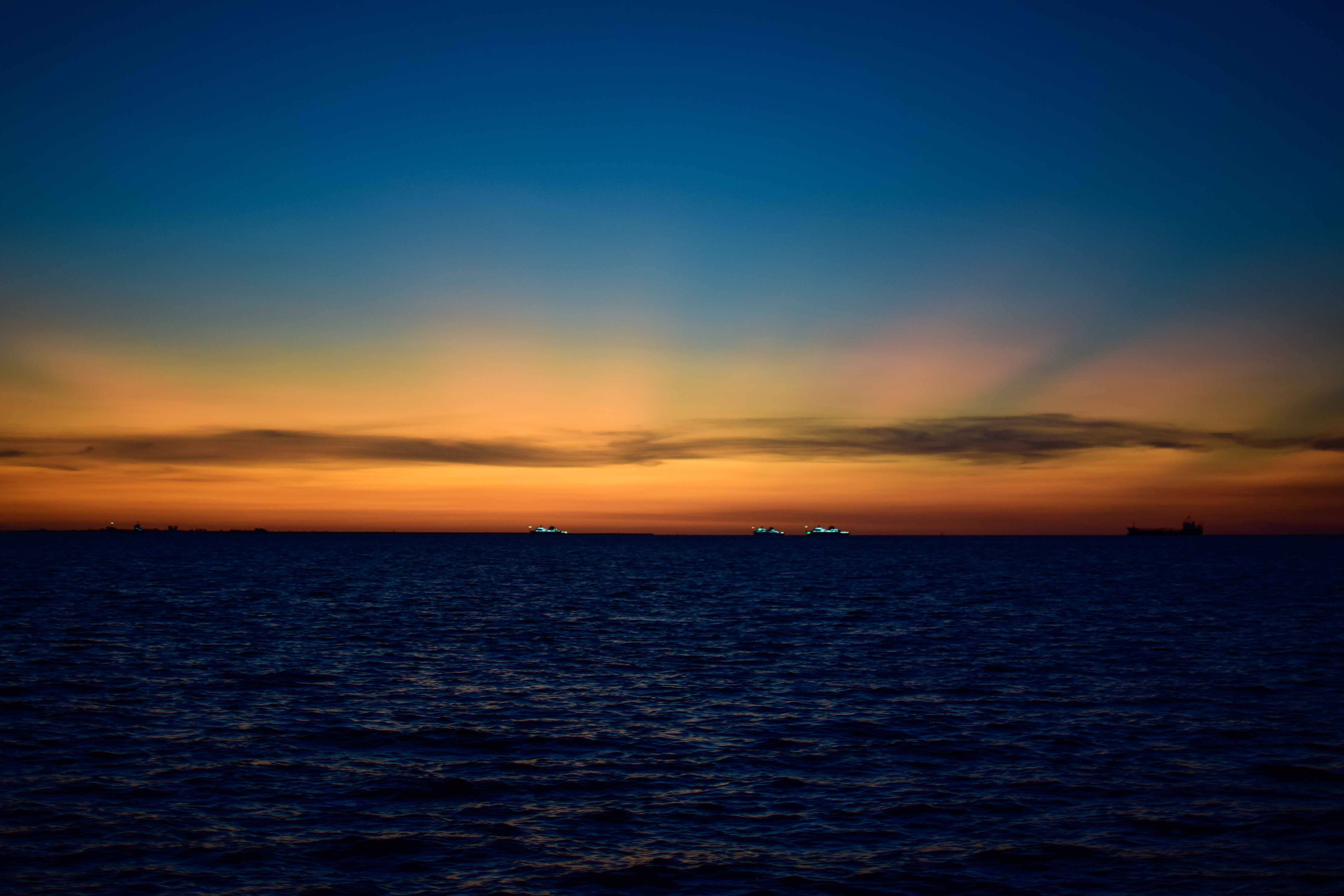 4K Sunset over the Ocean with Ships HD Wallpaper