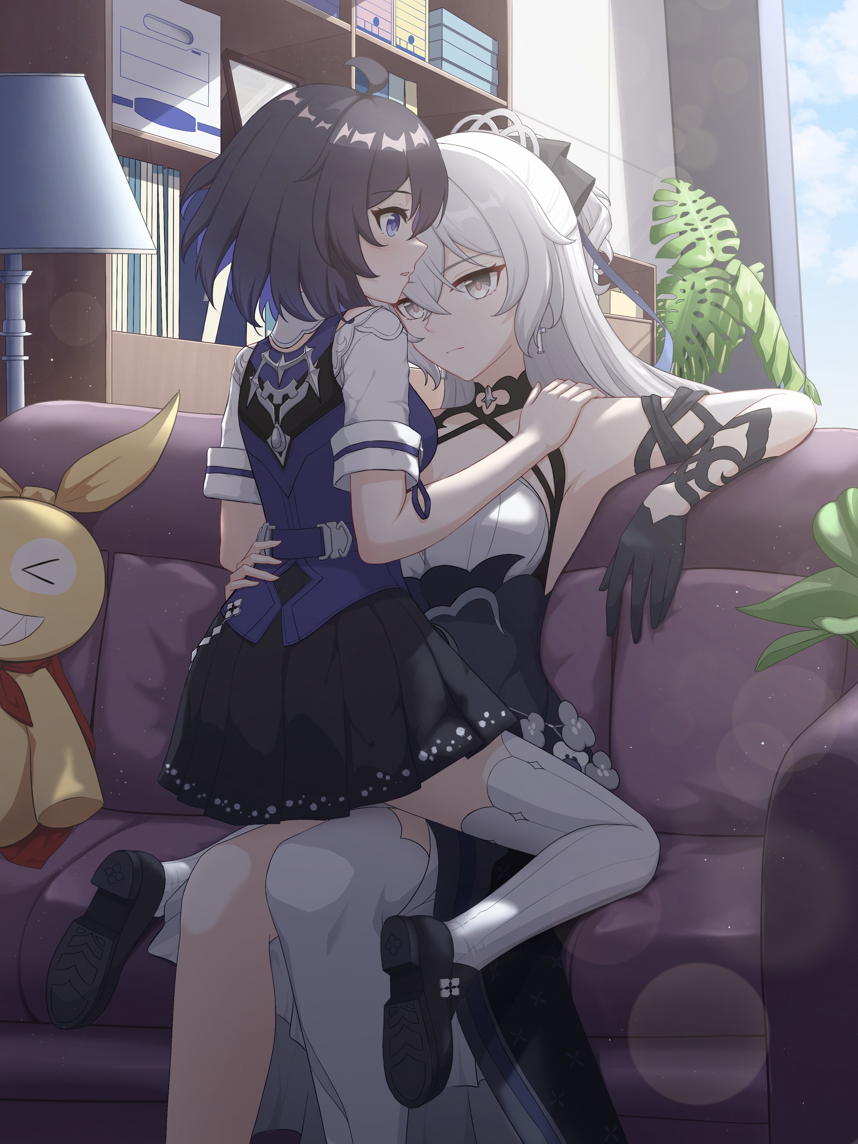 Two anime girls embracing on a couch HD Phone Wallpaper