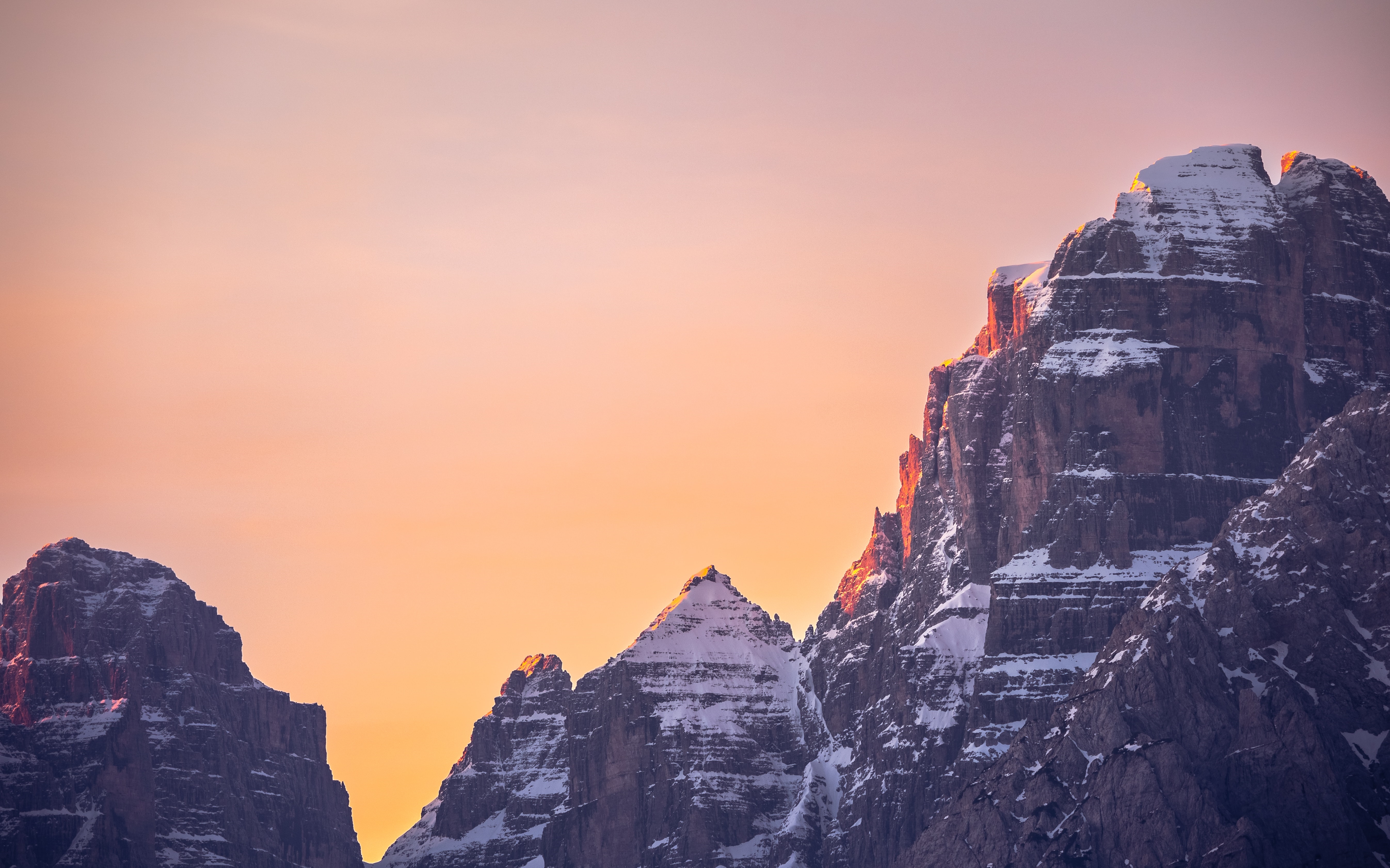 4K snow-capped mountains at sunset HD Wallpaper