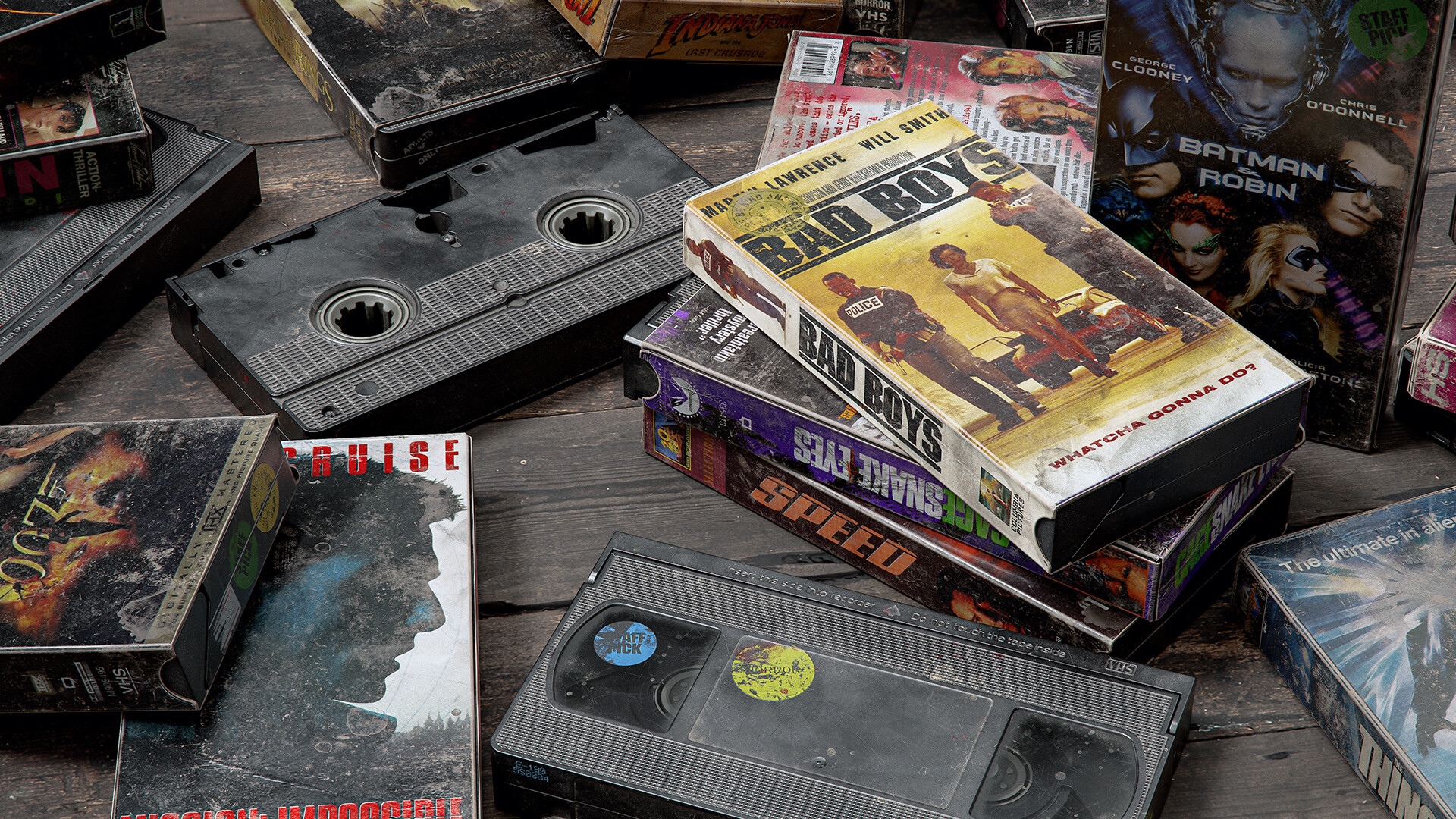 Collection of VHS tapes including Bad Boys and Batman & Robin HD Wallpaper