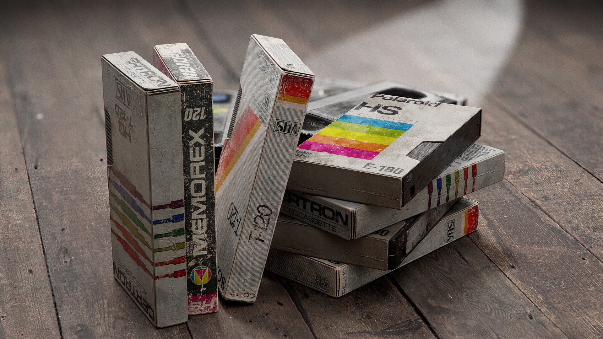 Stack of vintage VHS tapes including Memorex and Polaroid HD Wallpaper