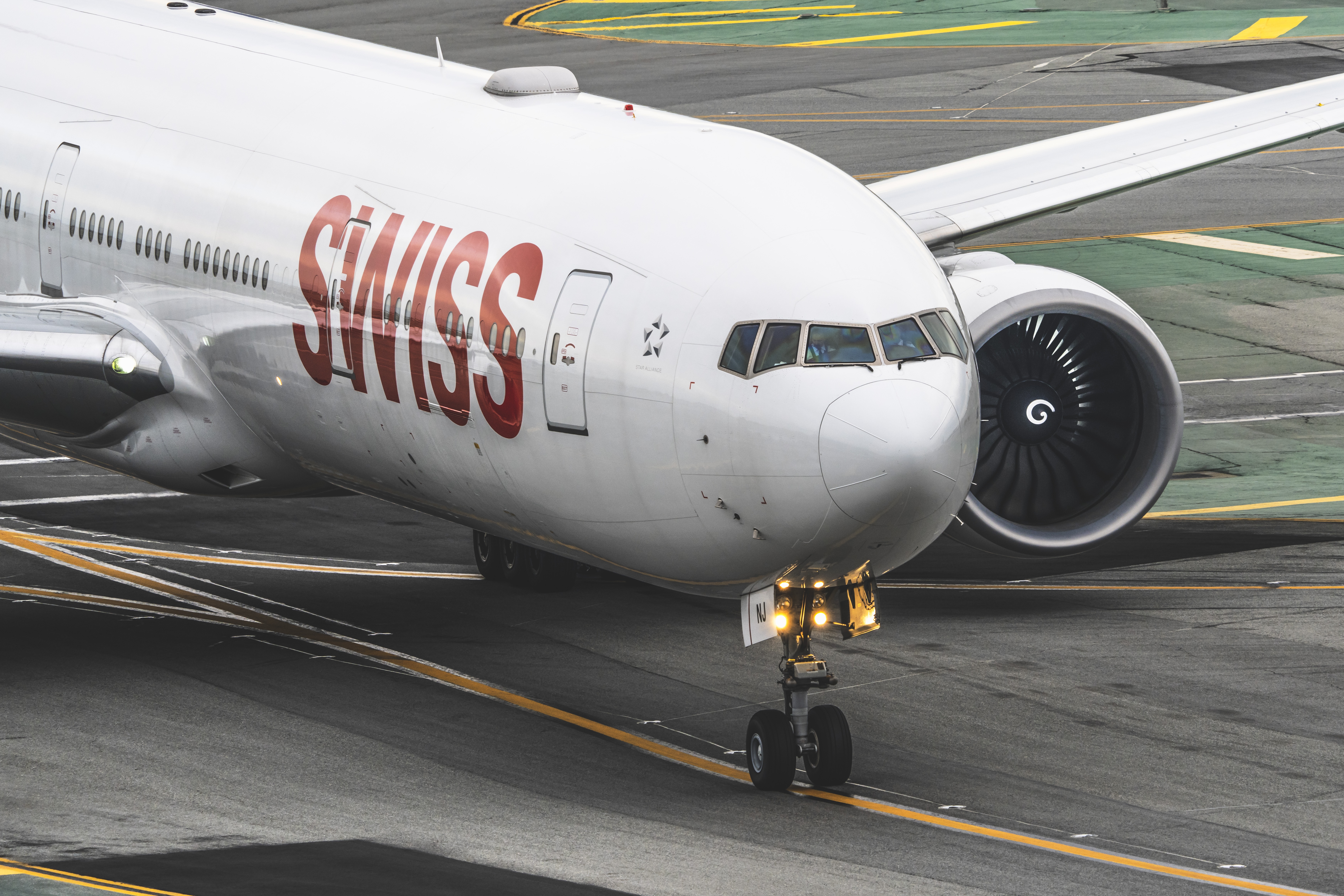 Swiss airplane on the tarmac HD Wallpaper