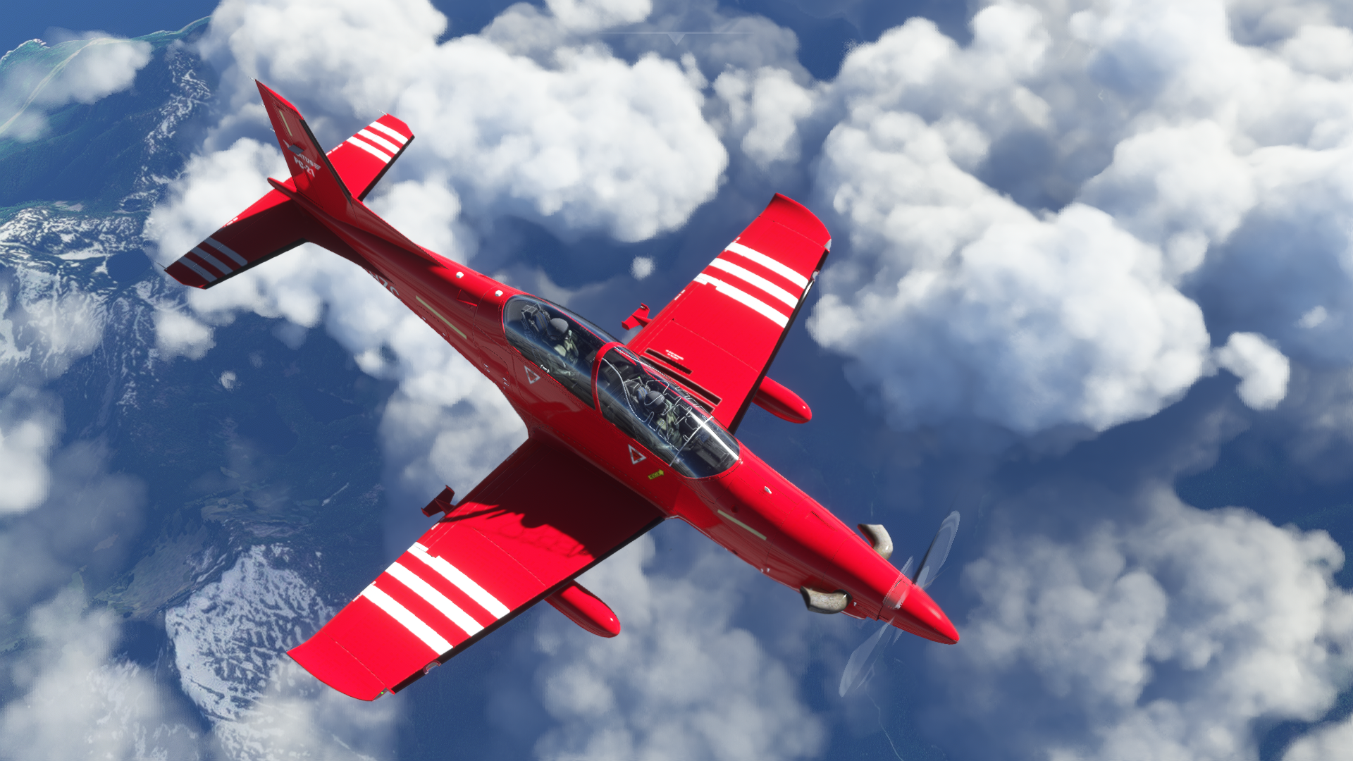 Red Pilatus PC-21 Aircraft Flying Over Mountains HD Wallpaper