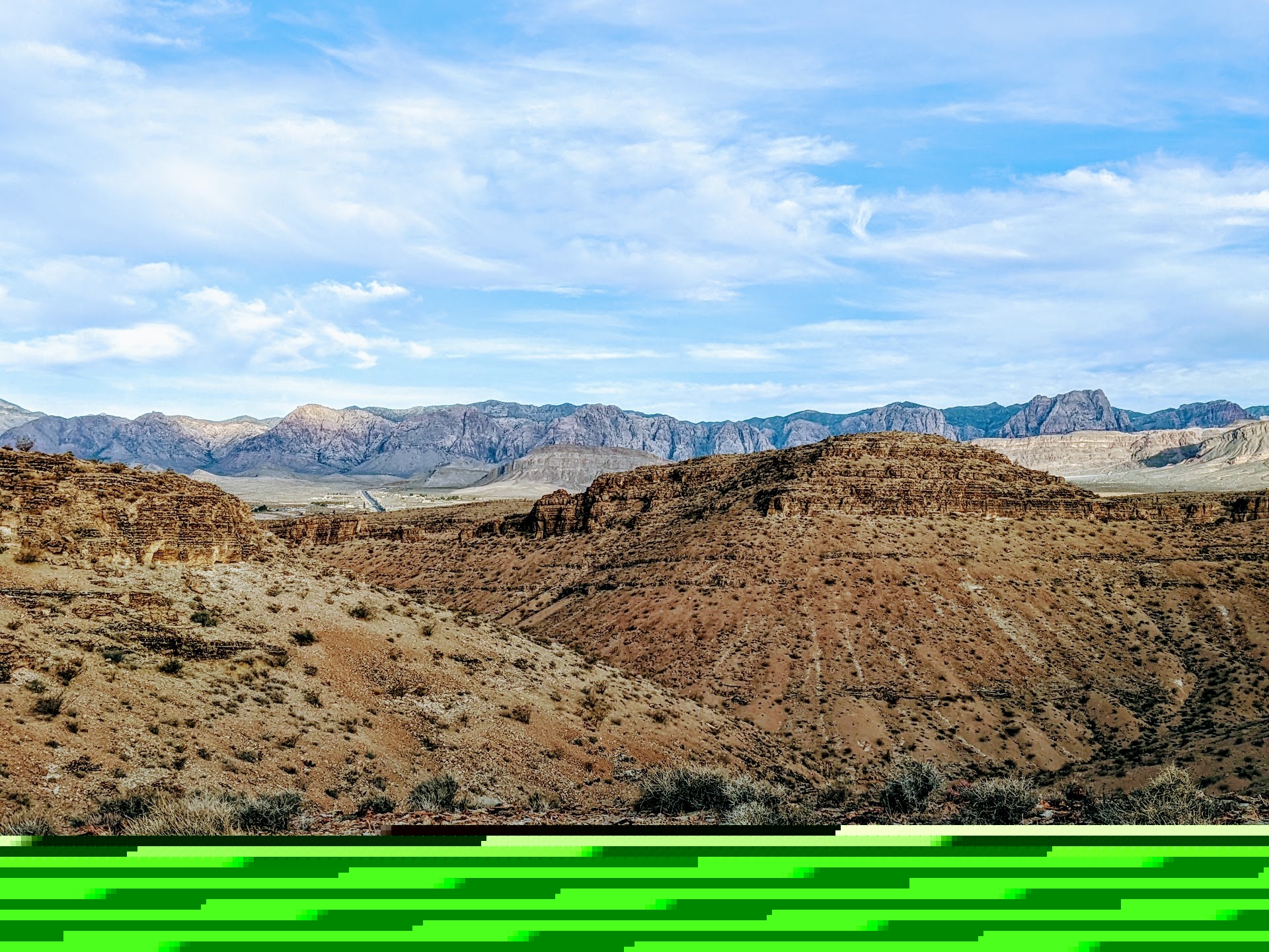 Desert mountains under a cloudy blue sky HD Wallpaper