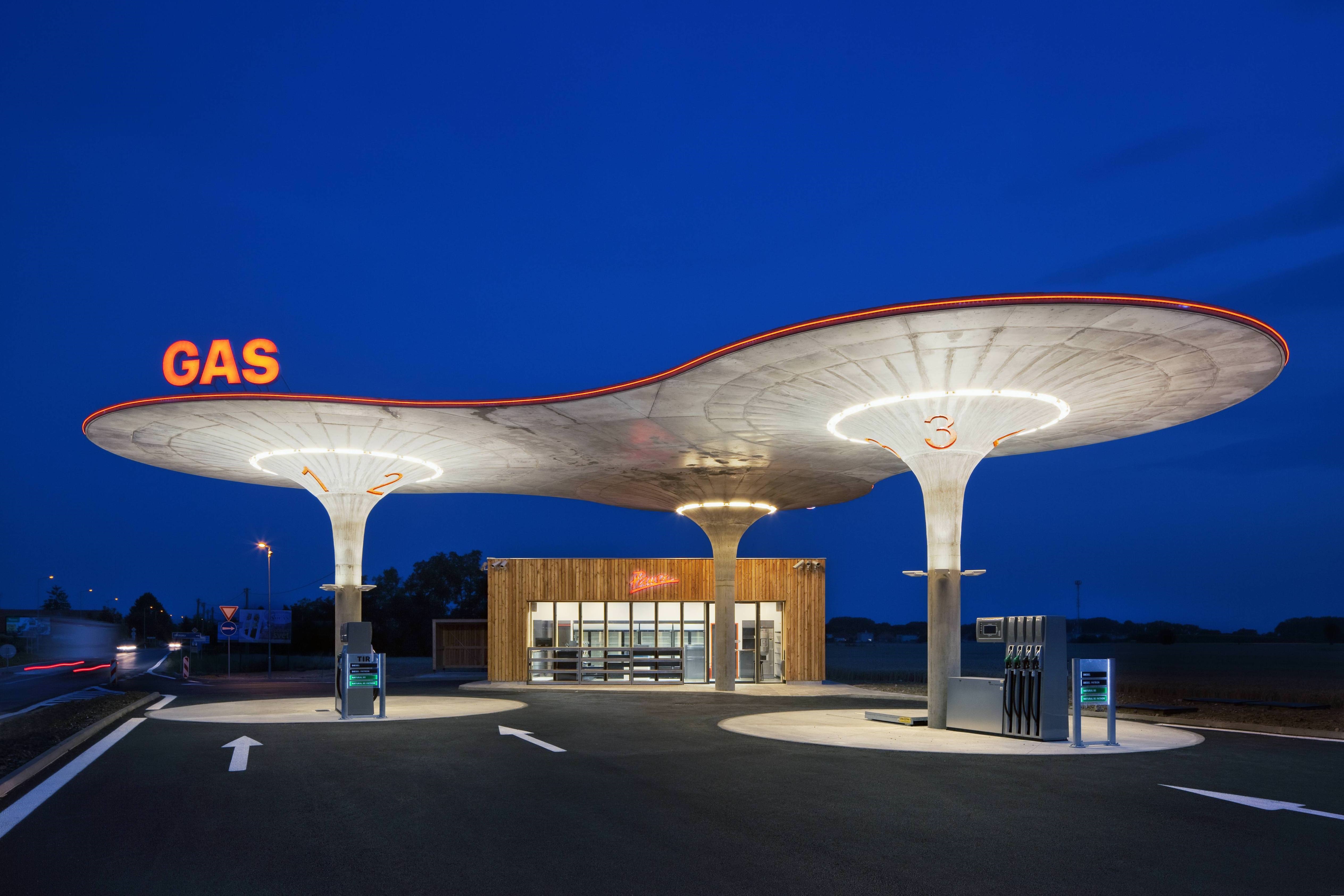 Gas station at night with modern canopy HD Wallpaper