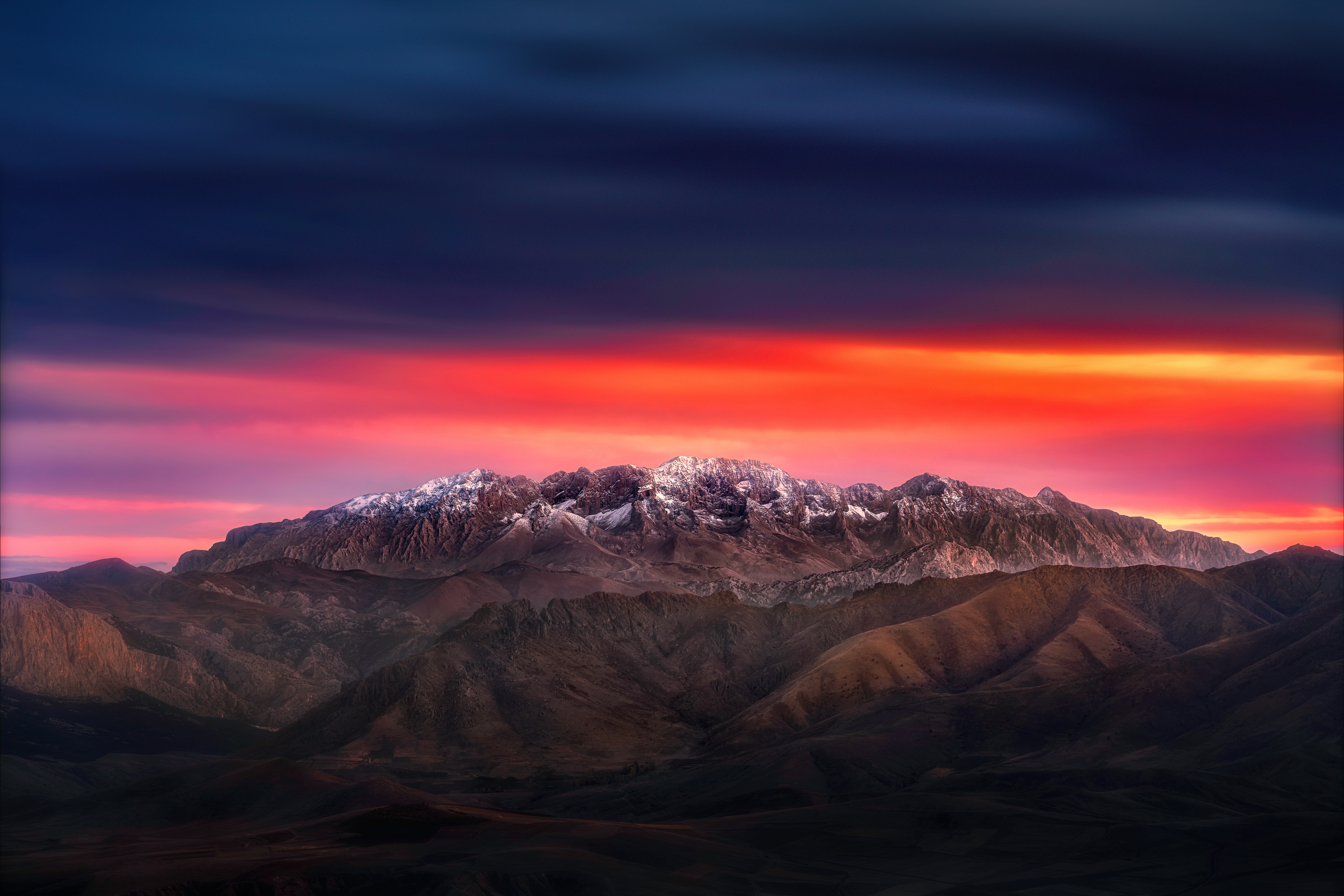 4K sunset over snow-capped mountains HD Wallpaper