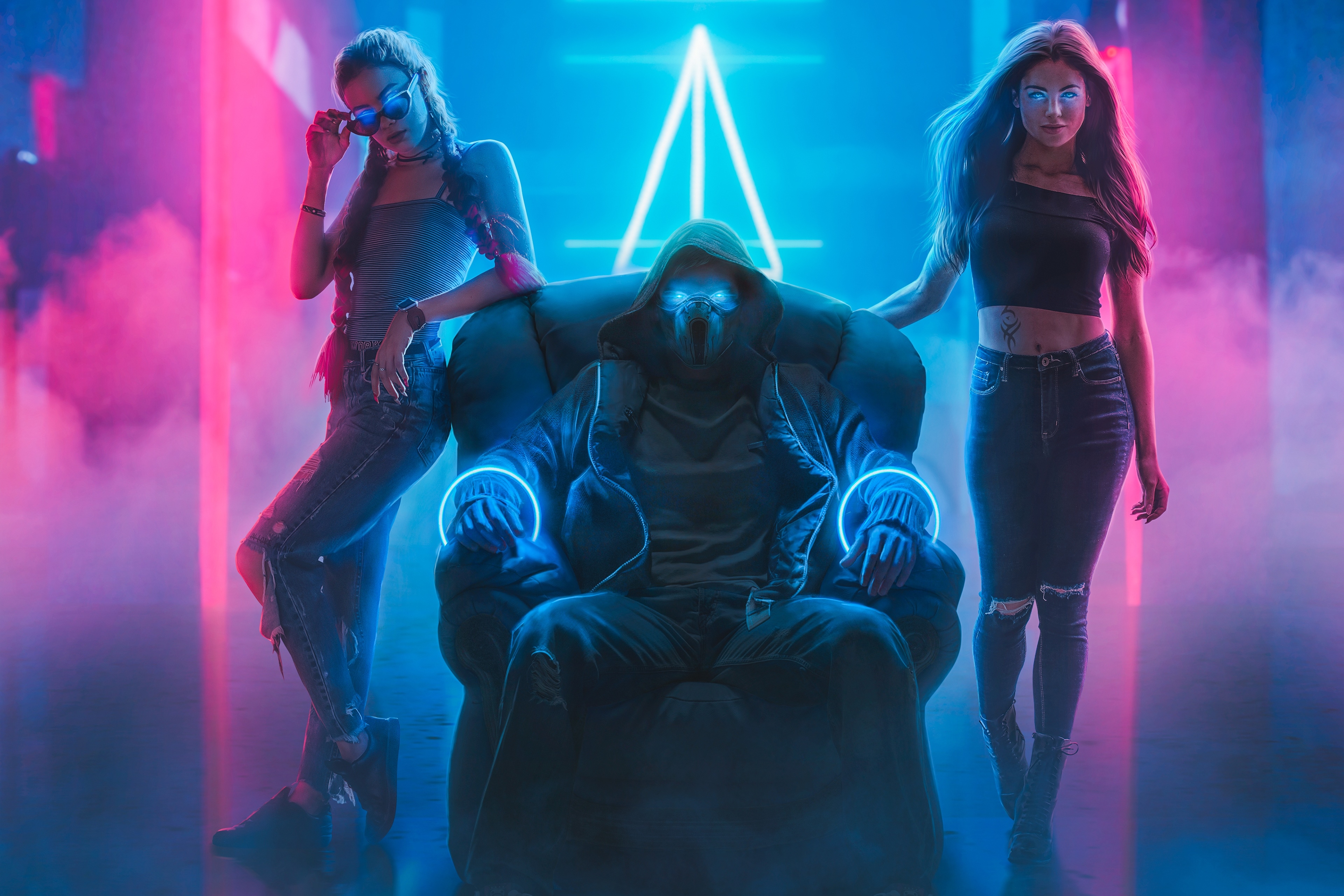 Man in mask with two women in neon club HD Wallpaper
