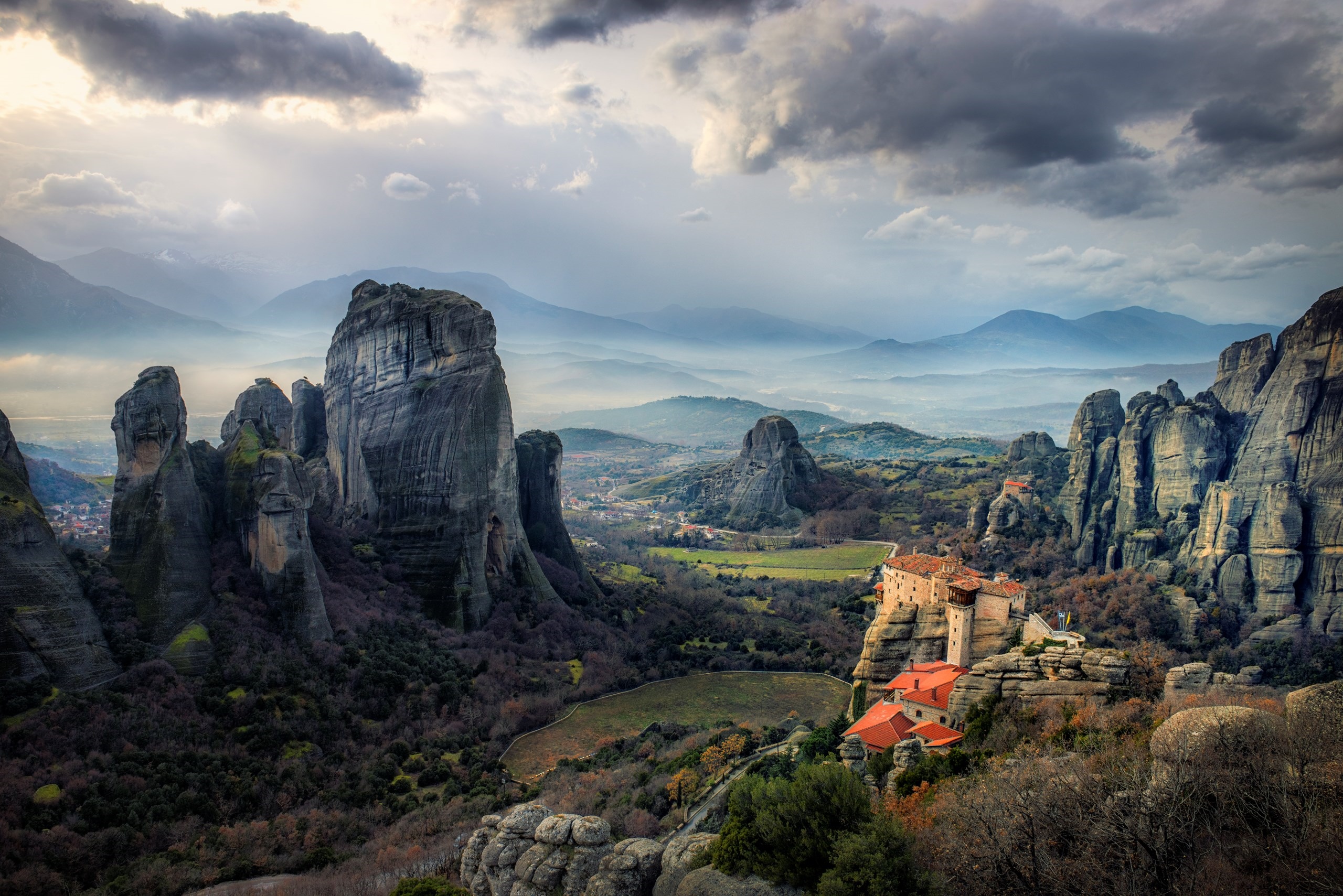 Meteora monasteries perched on rock formations in Greece HD Wallpaper