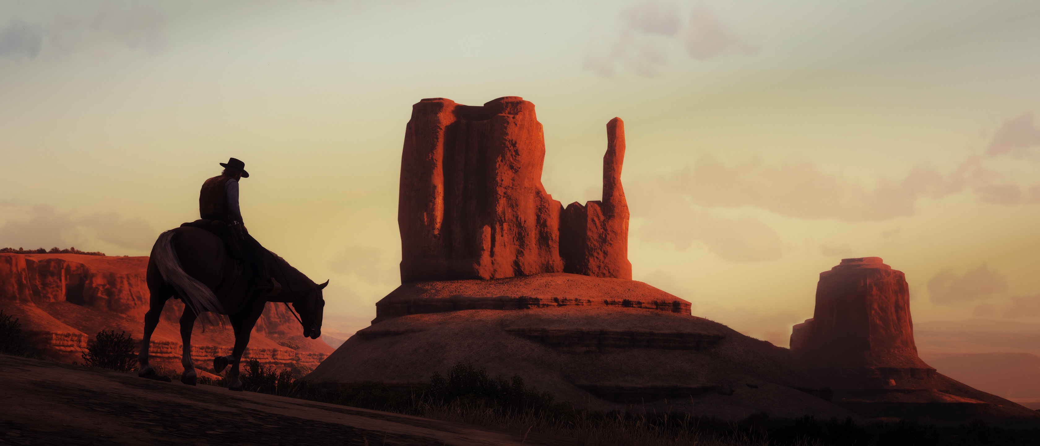 John Marston rides a horse at sunset in Red Dead Redemption 2 HD Wallpaper