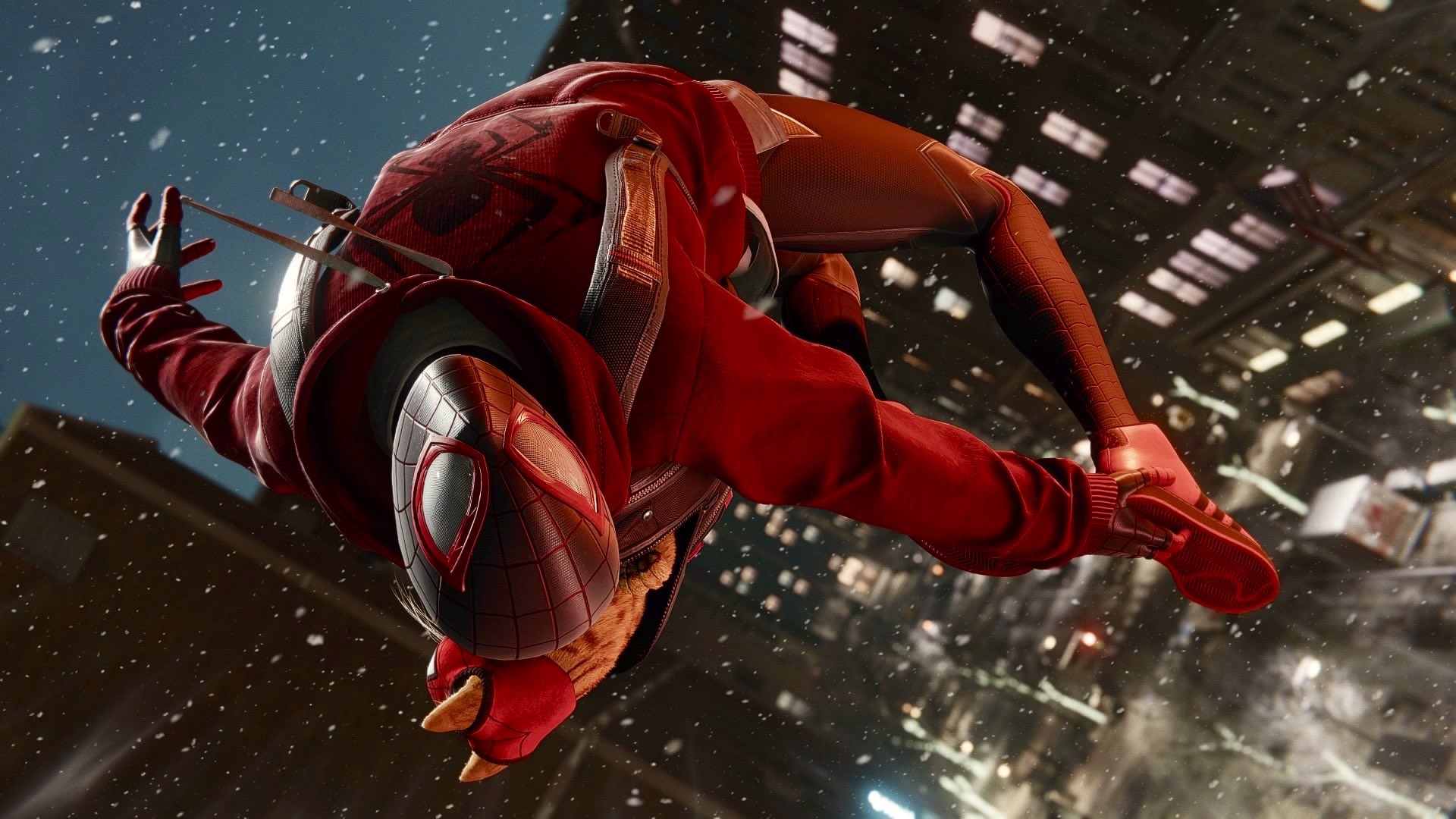 Miles Morales in Spider-Man swinging through a city HD Wallpaper