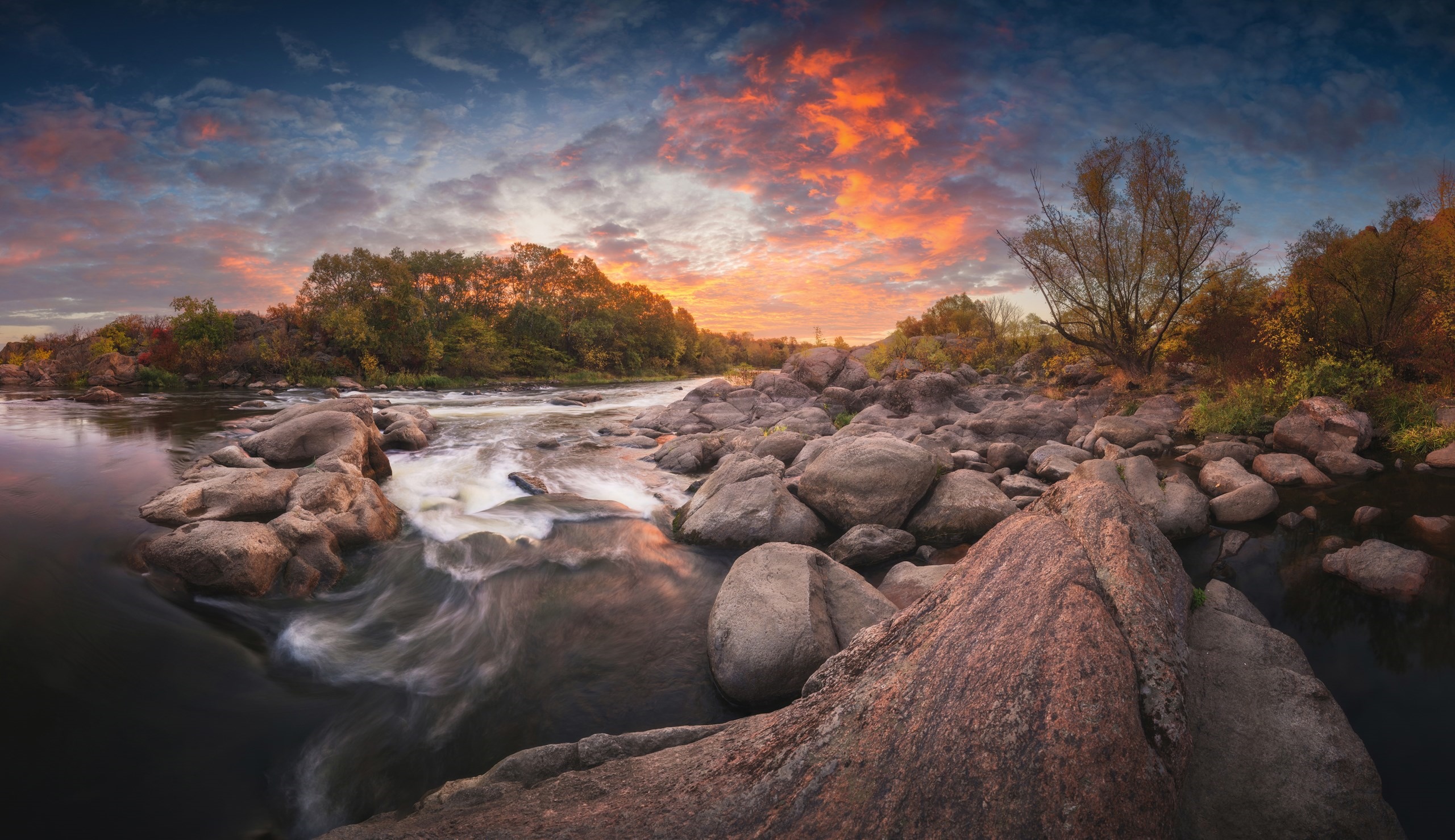 Sunset over a rocky river landscape HD Wallpaper