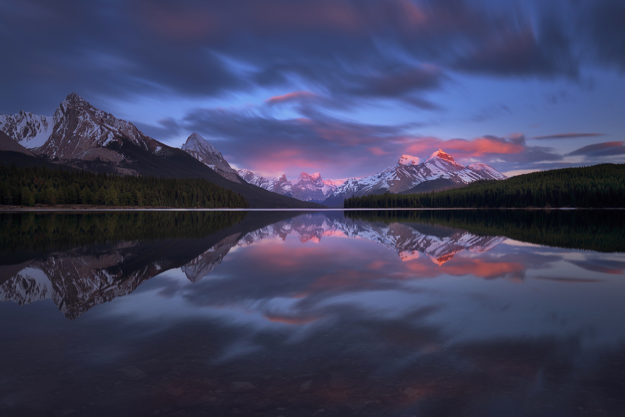 Mountains reflected in a lake at sunset with clouds HD Wallpaper