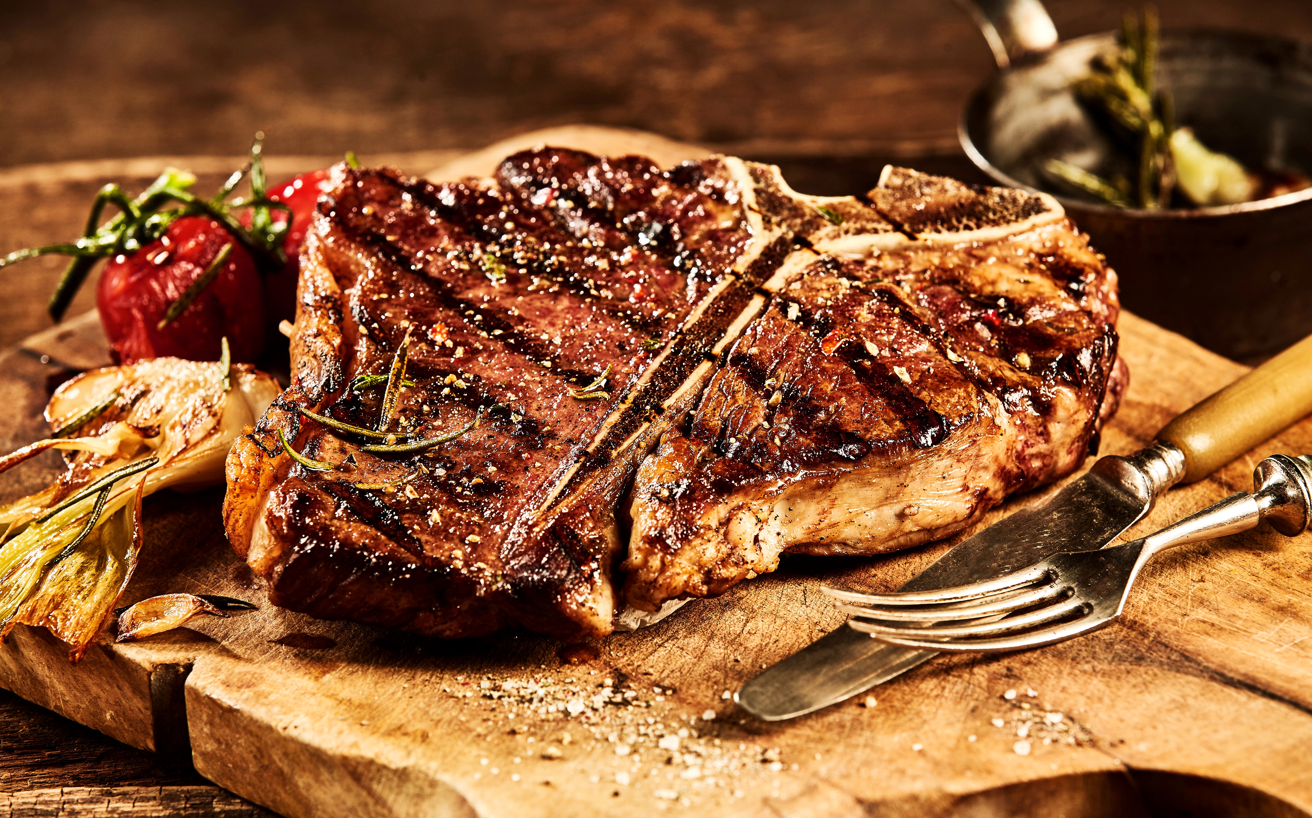 4K Porterhouse Steak with Sides on Cutting Board HD Wallpaper