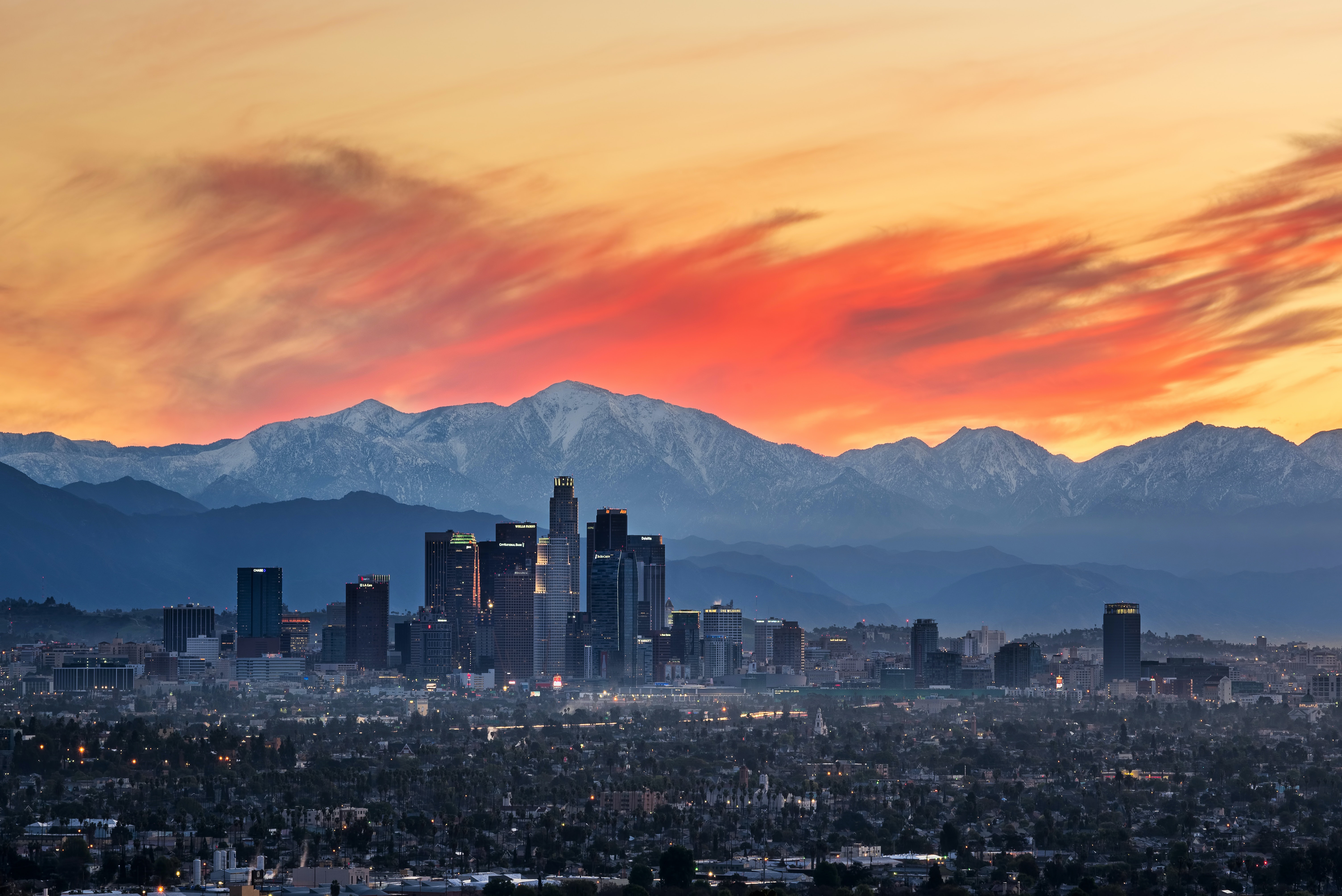 4K Los Angeles cityscape at sunrise with mountains HD Wallpaper