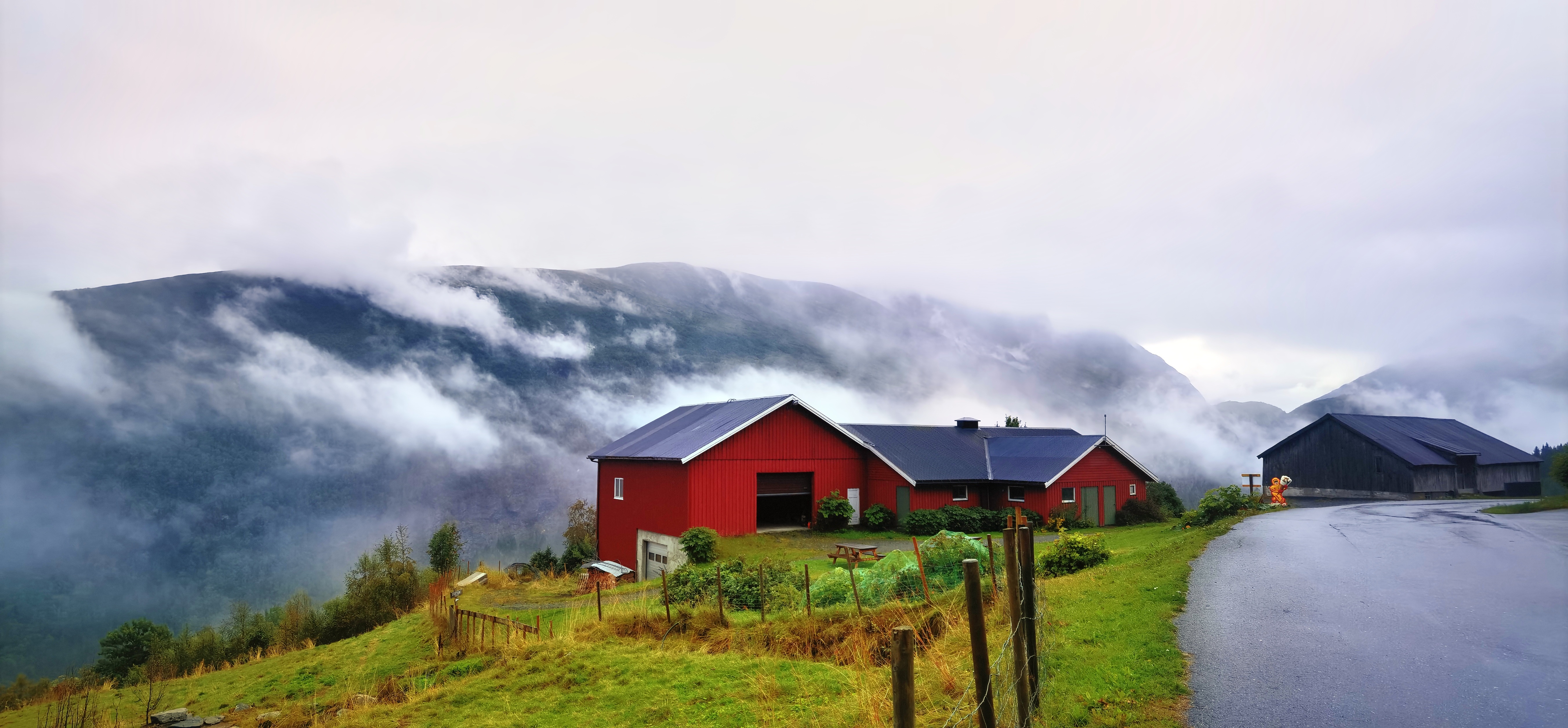 4K Norway mountains landscape with houses and clouds HD Wallpaper