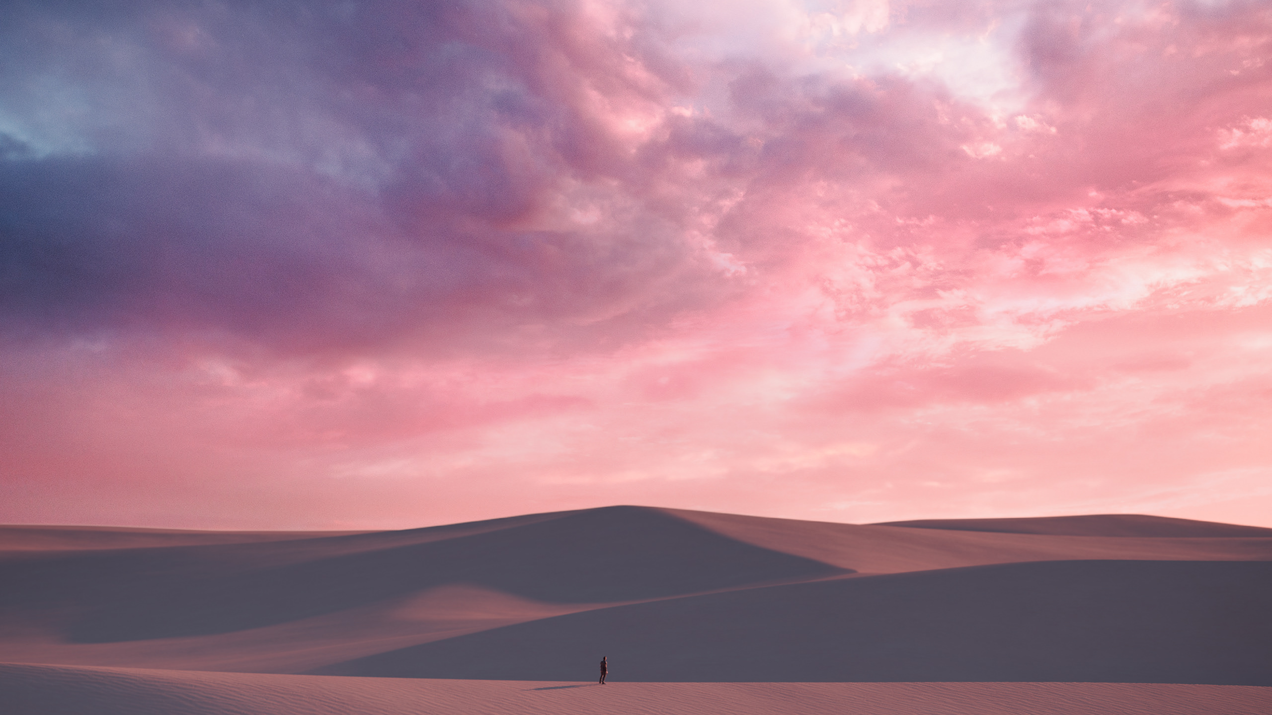Person walking through desert dunes at sunset HD Wallpaper