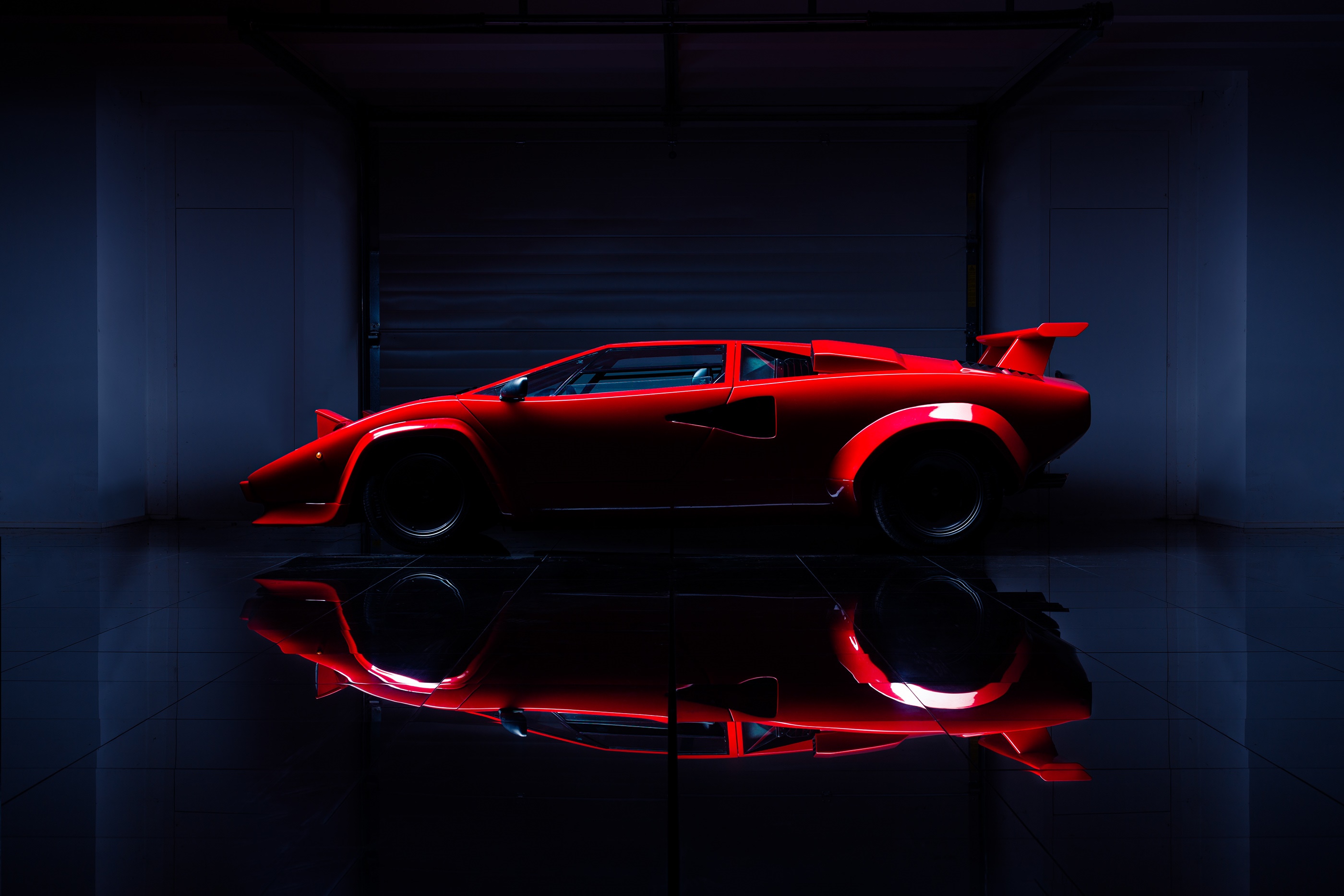 Red Lamborghini Countach in a dark garage HD Wallpaper