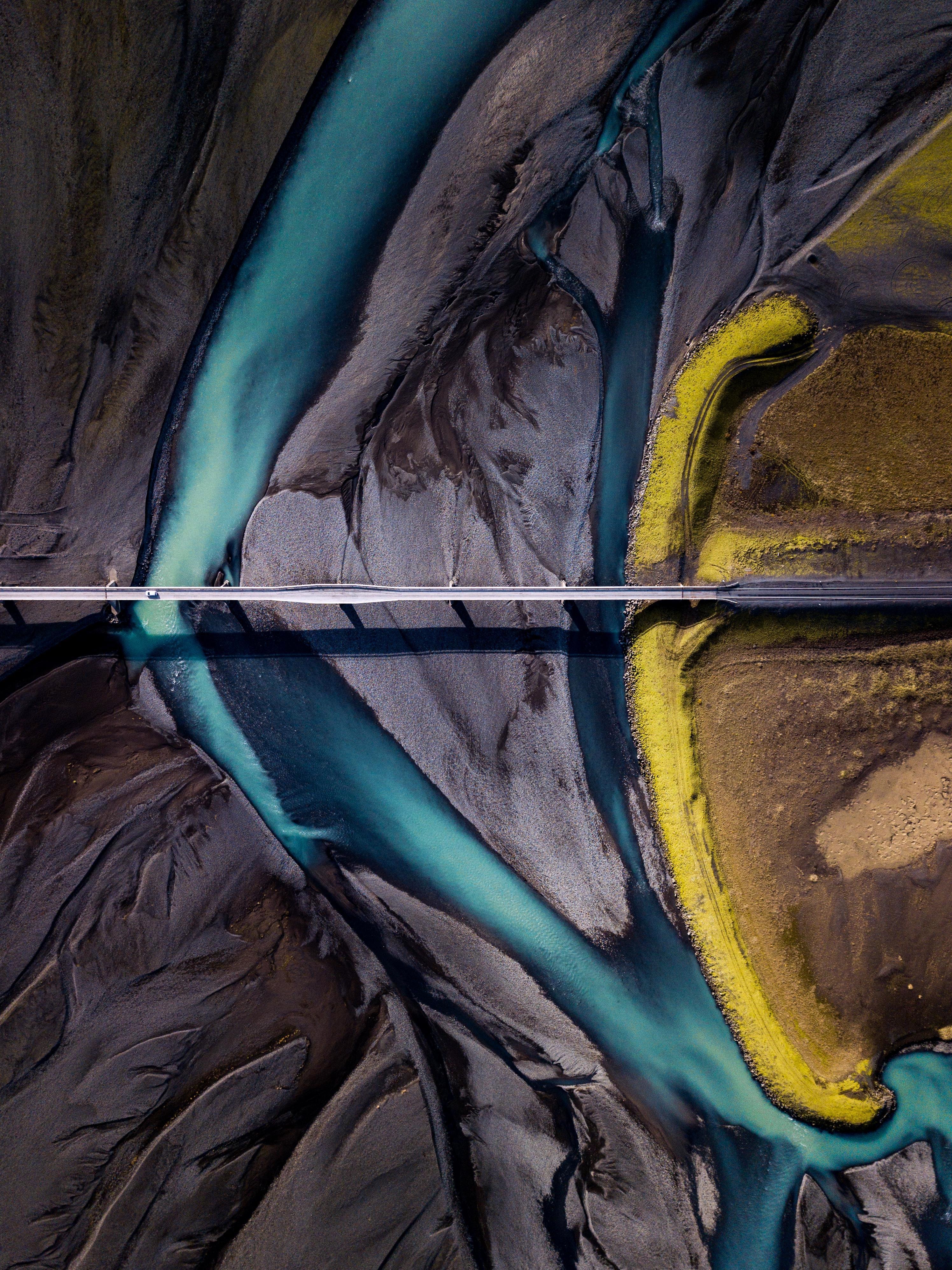 Aerial view of a river delta with a bridge HD Phone Wallpaper