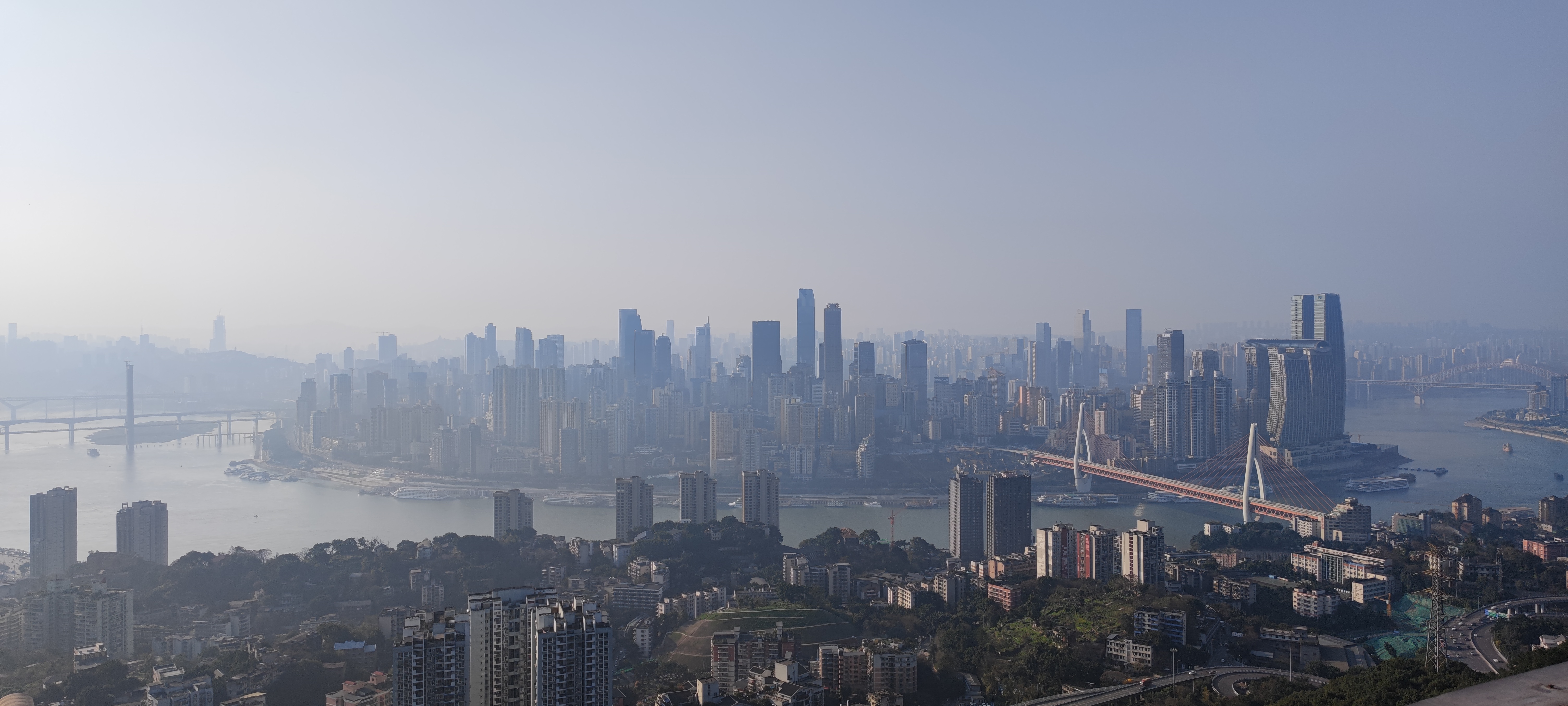 4K Smoggy Chongqing Cityscape with Bridges and Skyscrapers HD Wallpaper