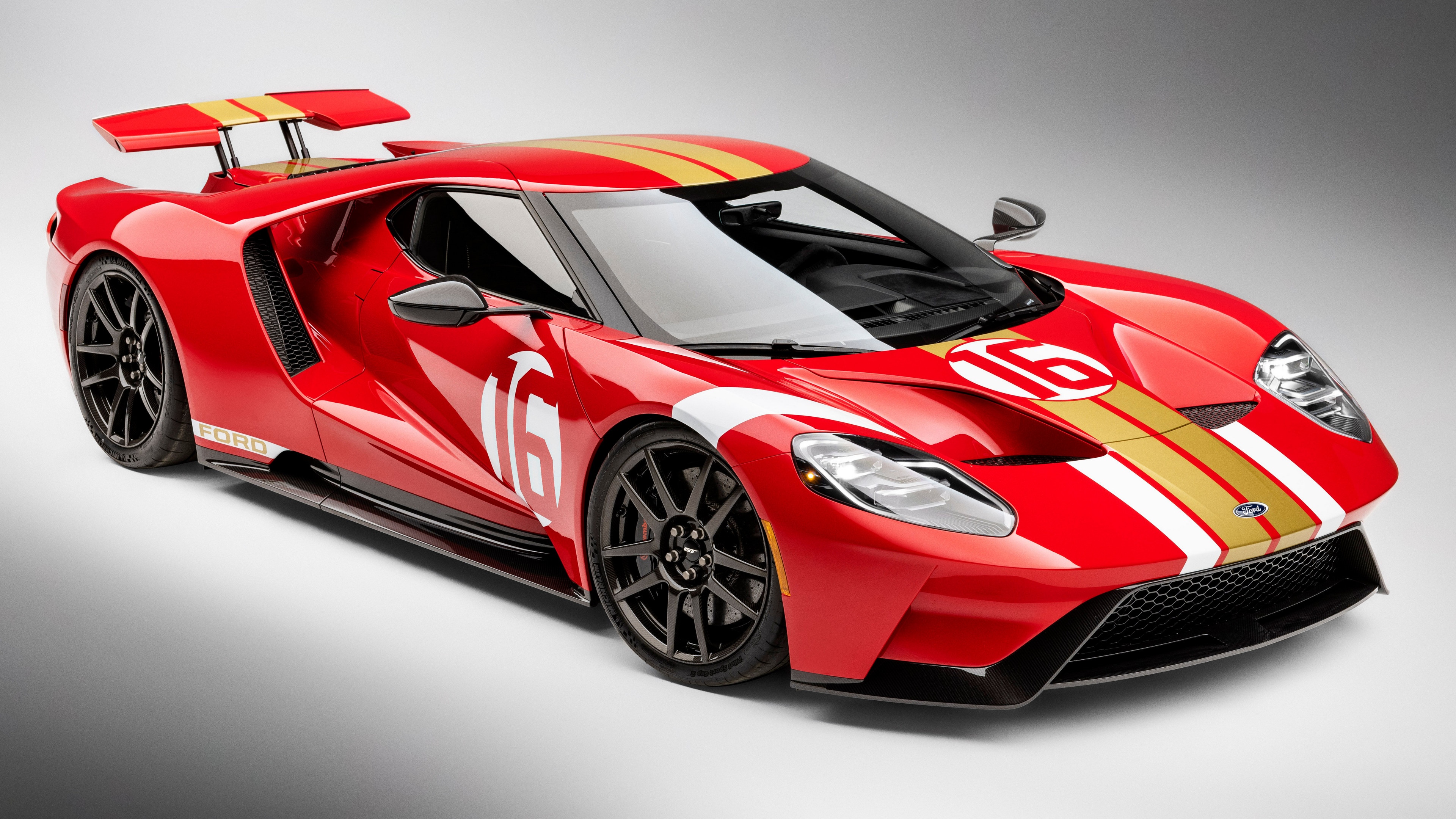 Red Ford GT with racing stripes and number 16 HD Wallpaper