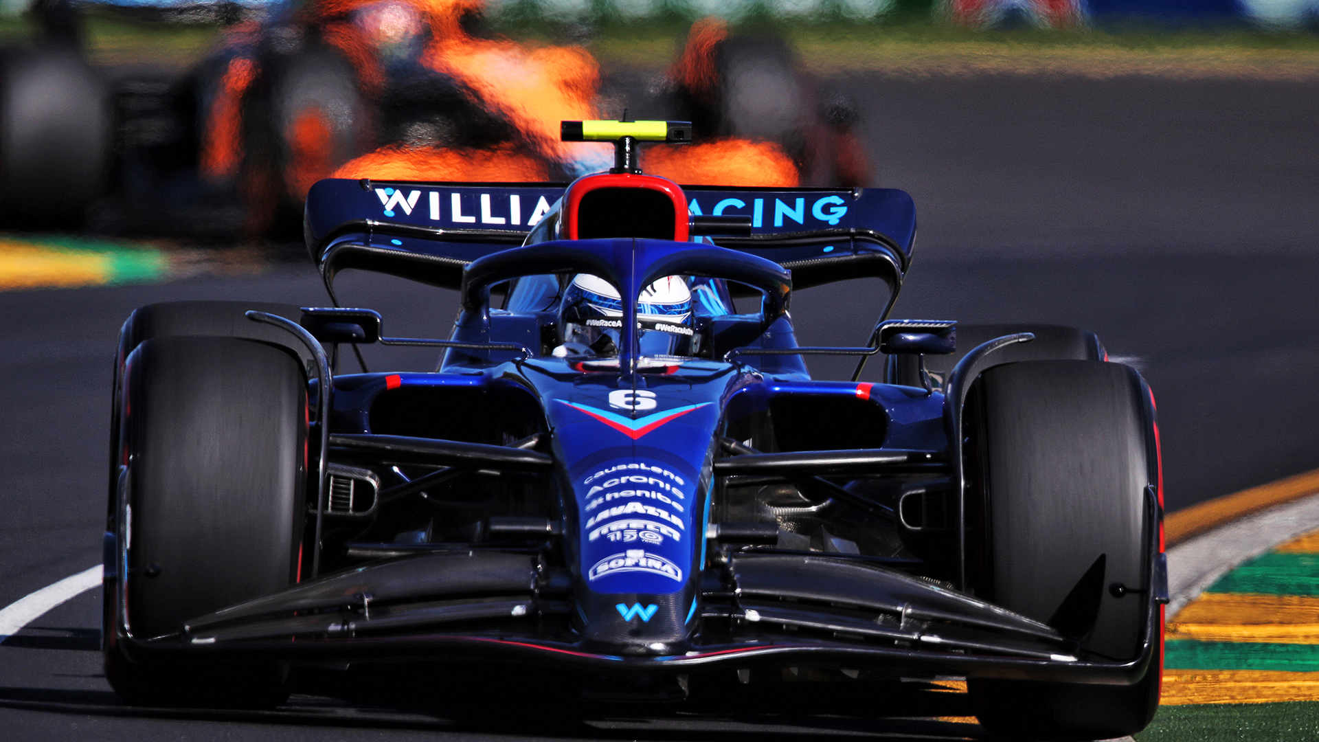 Williams F1 car racing on a track HD Wallpaper