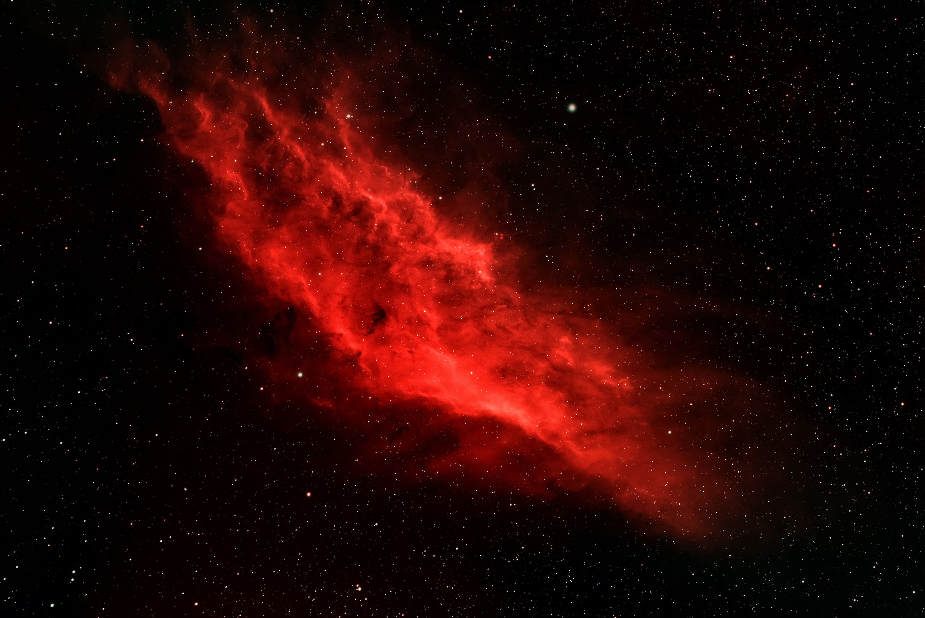 Red nebula in a star-filled galaxy HD Wallpaper