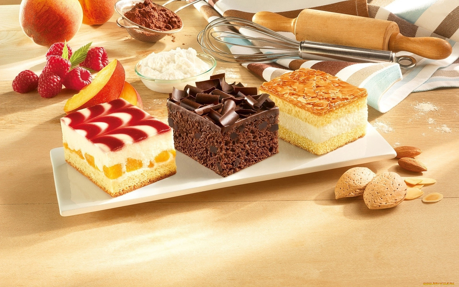 Three cakes with fruit, chocolate, and almonds HD Wallpaper