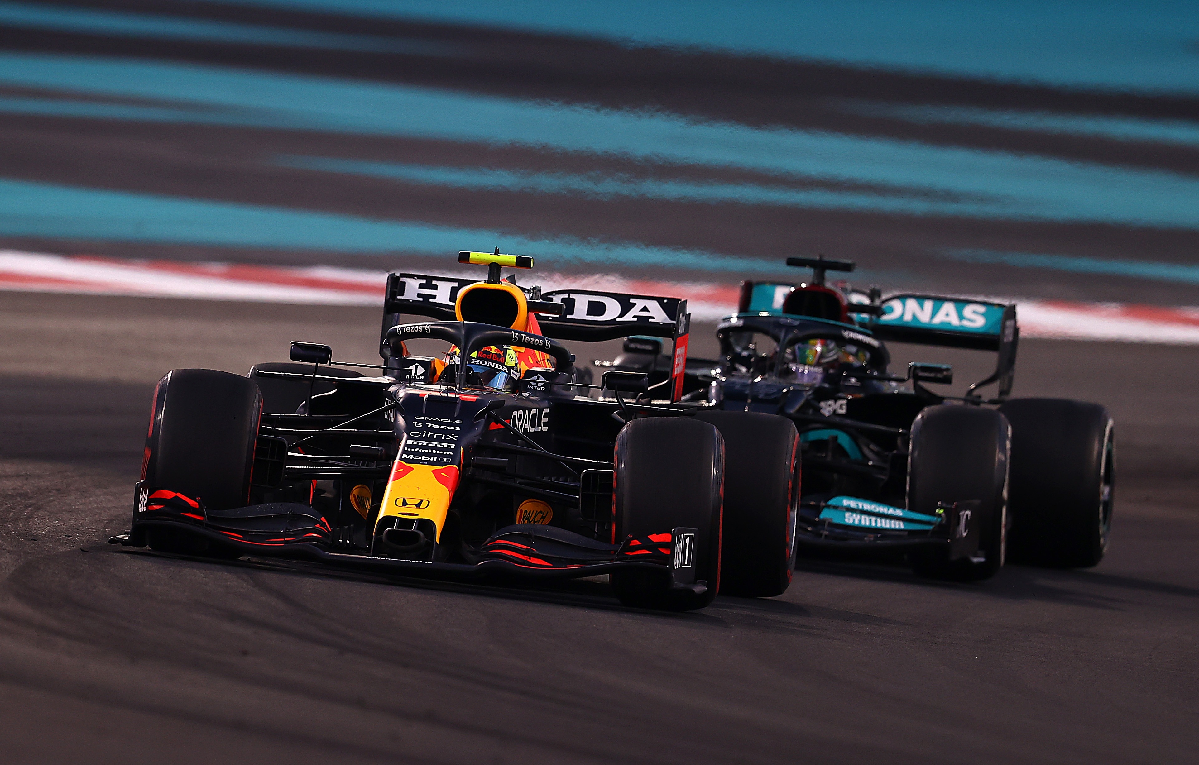 Sergio Pérez and Lewis Hamilton in Formula 1 race HD Wallpaper