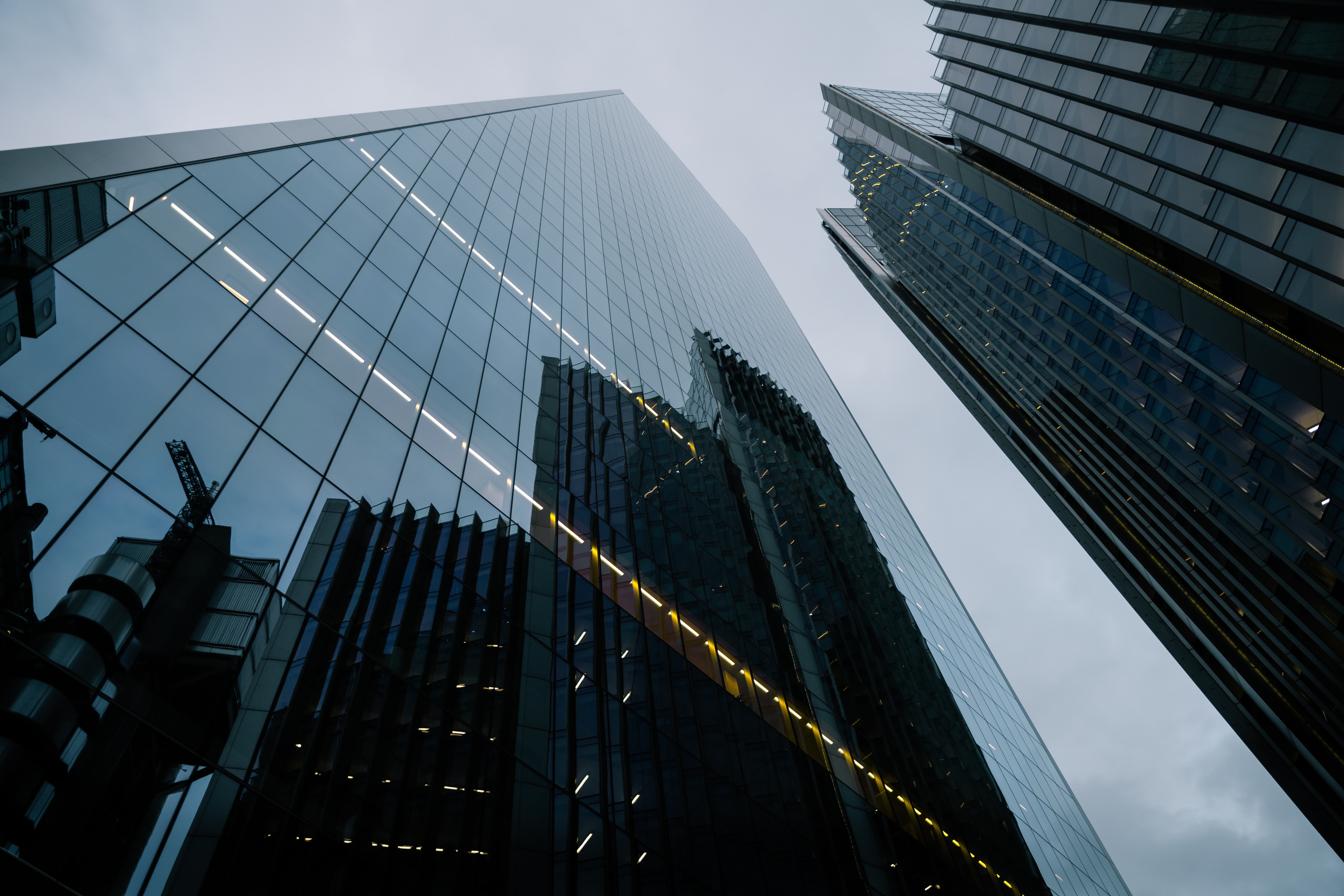 Modern skyscrapers with reflections in a city HD Wallpaper