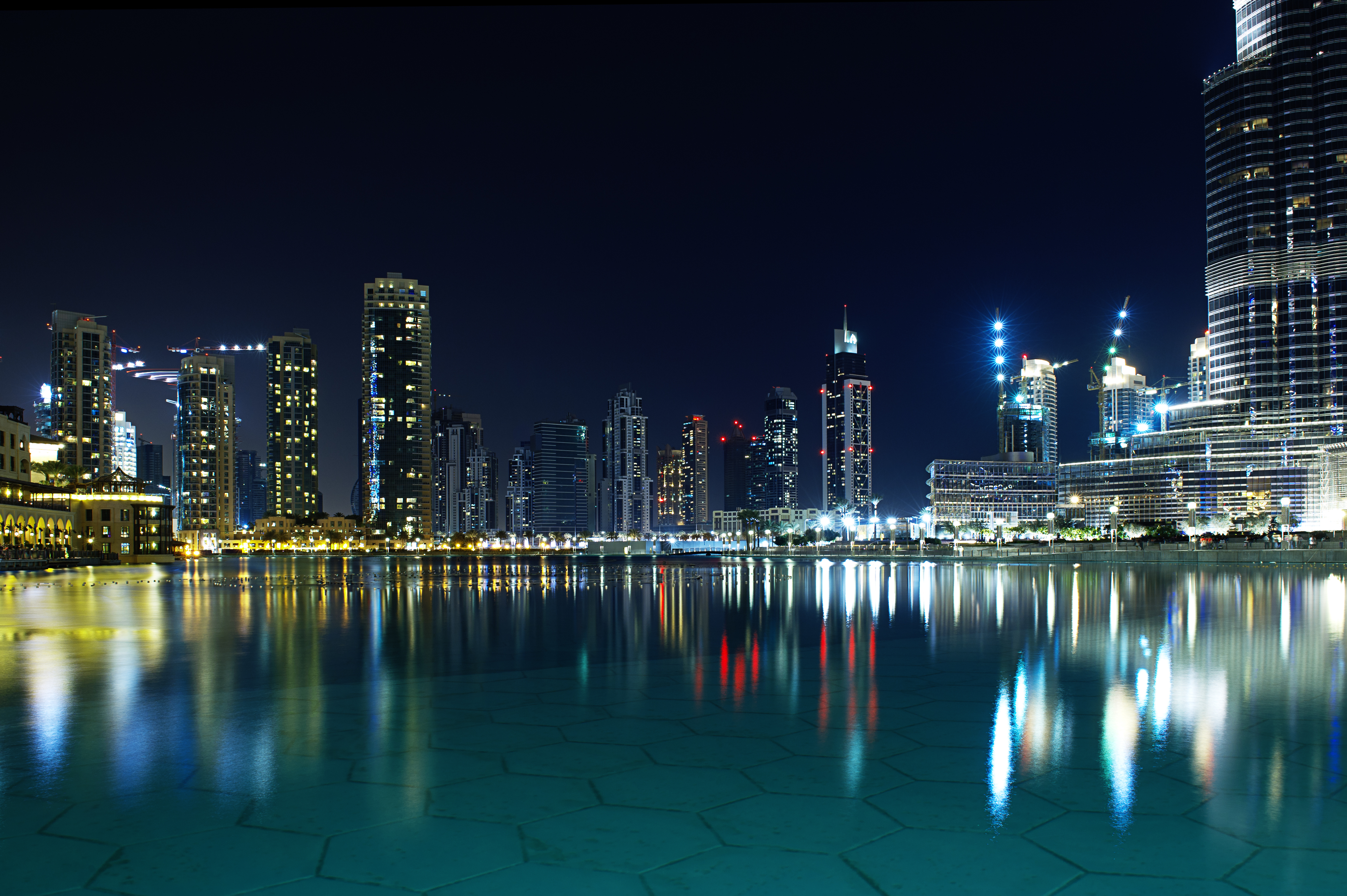 4K Dubai cityscape at night with water reflection HD Wallpaper