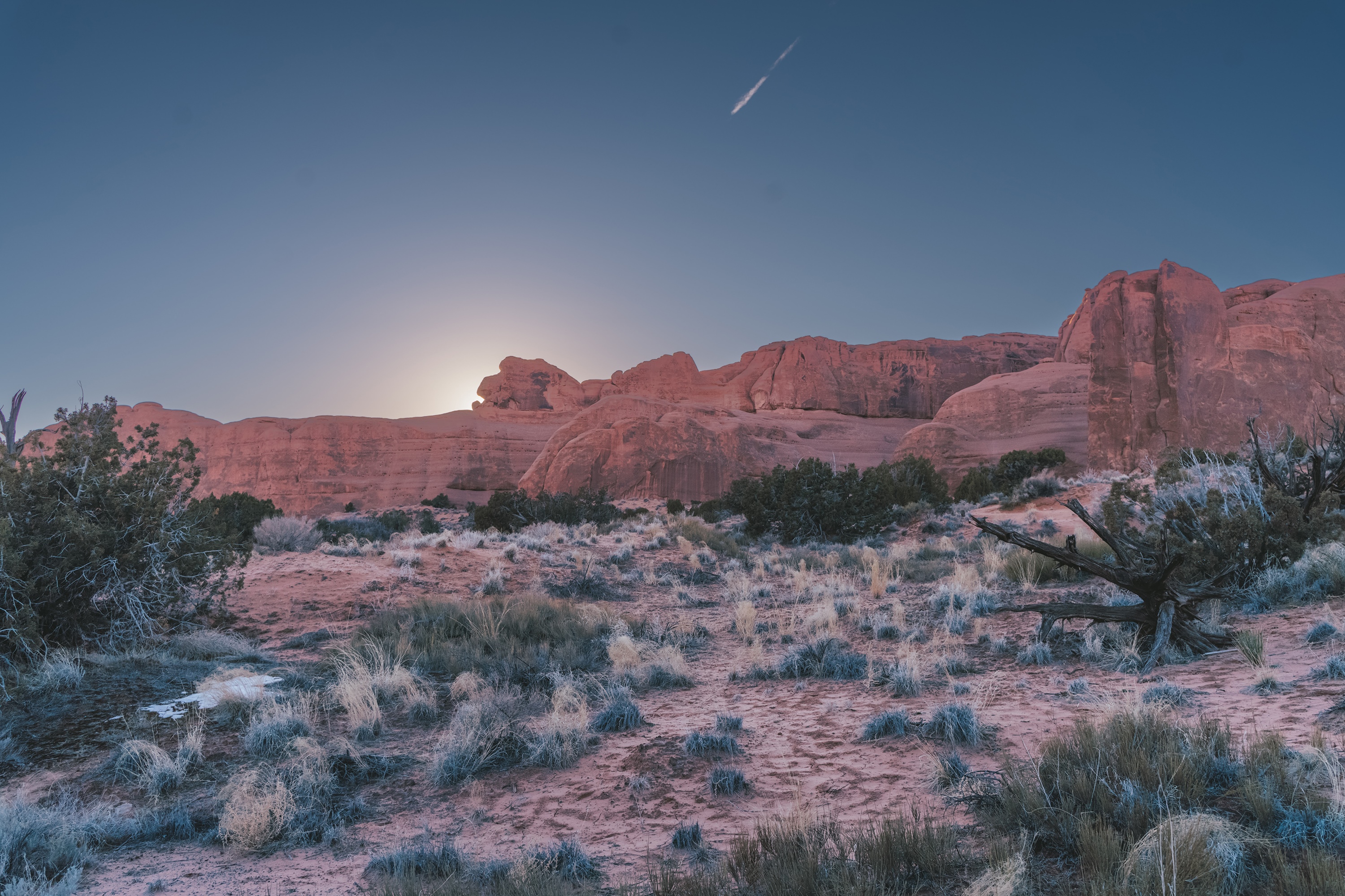 Desert landscape with red rock formations and clear sky HD Wallpaper