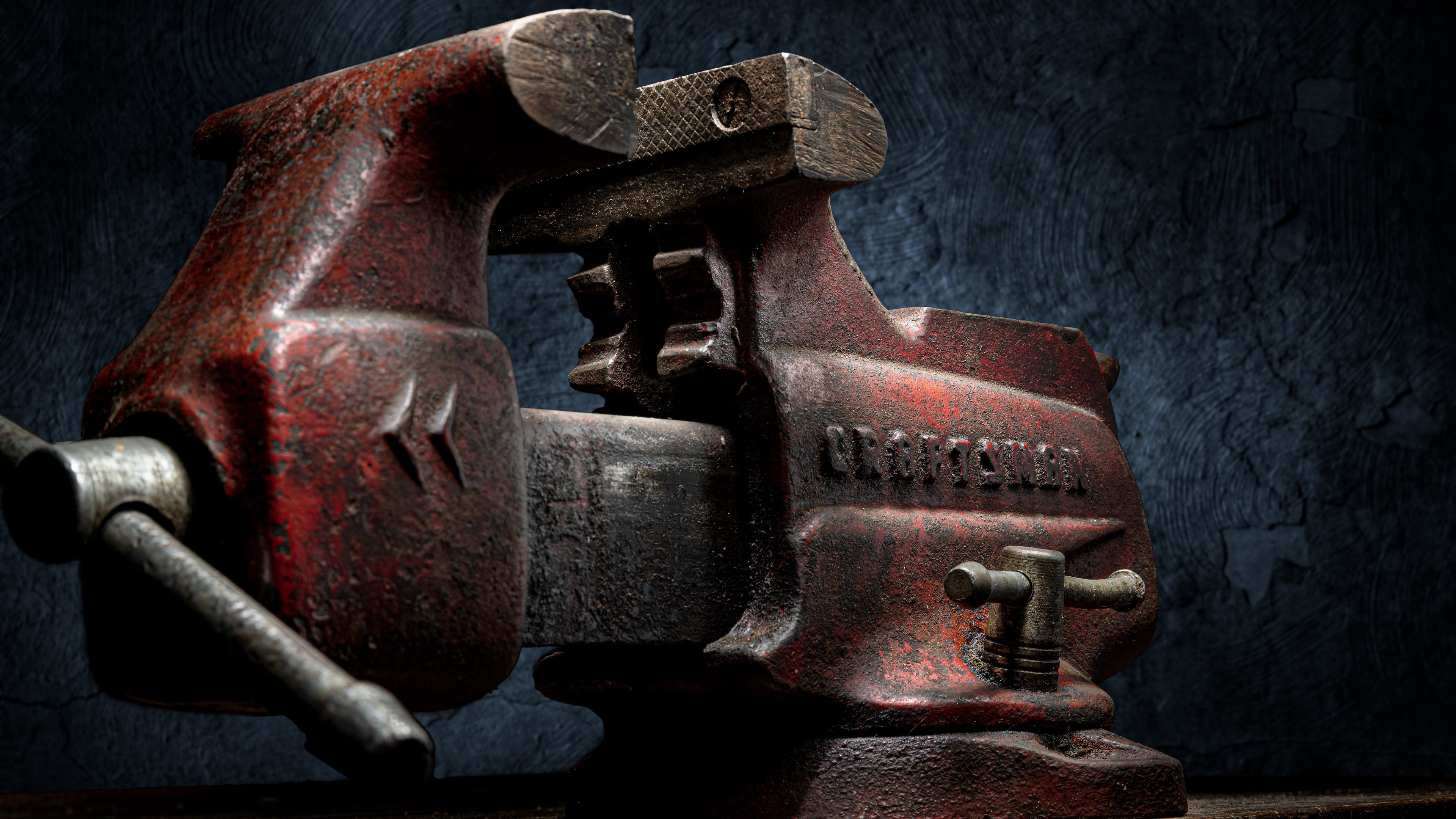 4K Craftsman jaw vice on a textured background HD Wallpaper