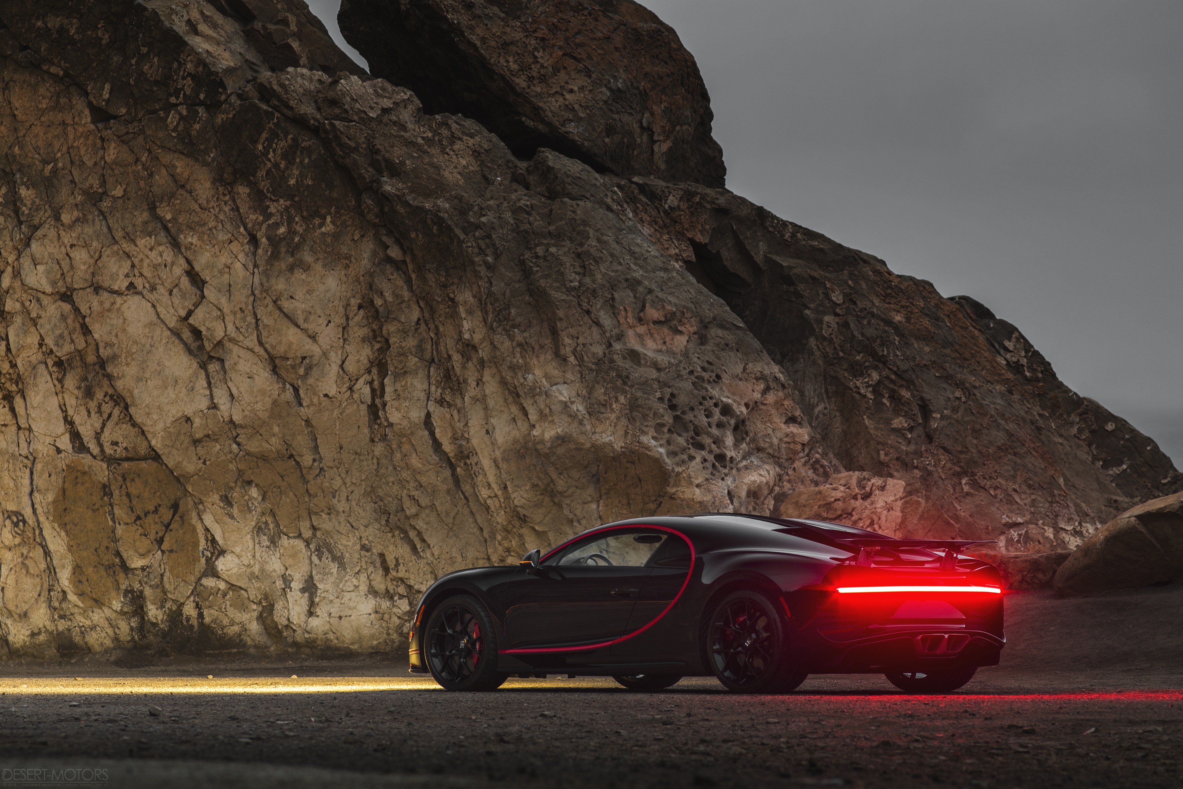 4K Bugatti Chiron parked near rocky cliffs HD Wallpaper